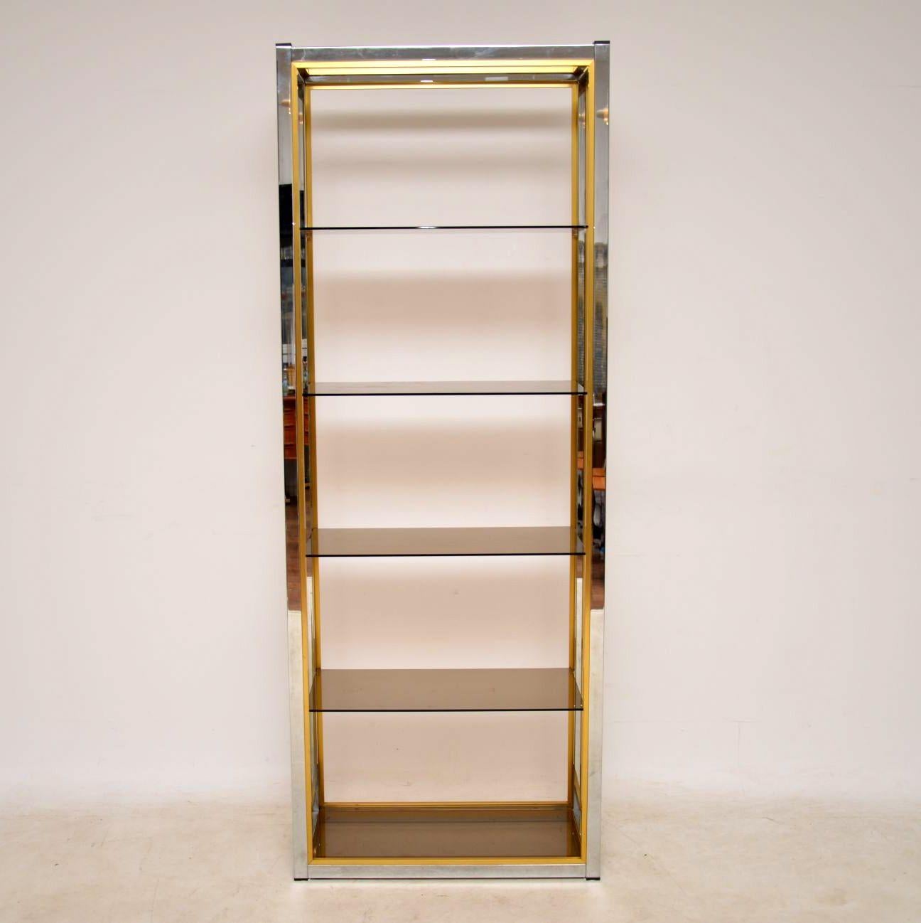 A stunning vintage bookcase / cabinet made in Italy during the 1970s, this was designed by Renato Zevi. These were originally retailed in Harrods, the quality is superb. The condition of this is excellent, with only some extremely minor surface