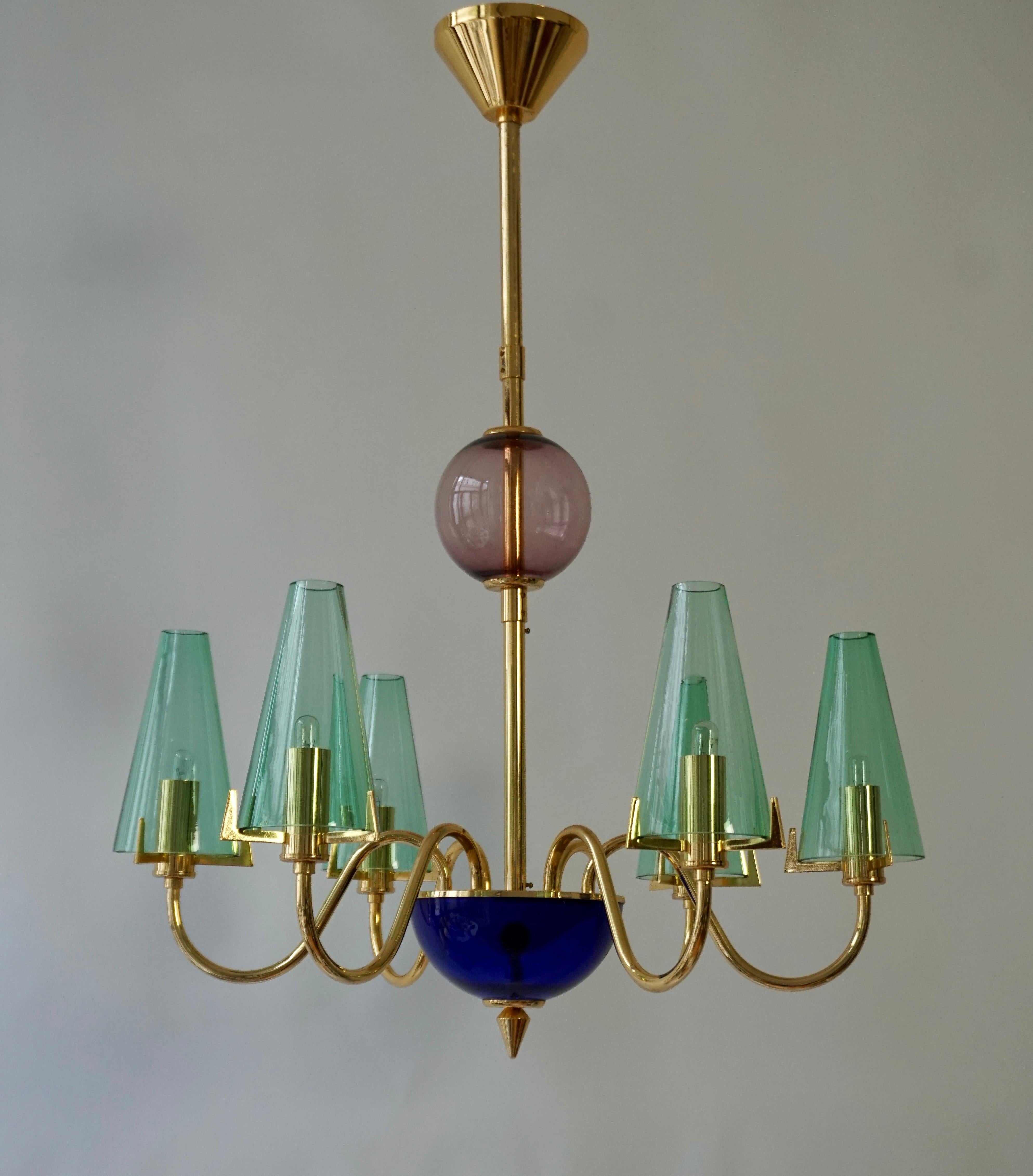 Italian Murano glass chandelier by F. Fabbian.

A 1960s Ceiling Light 'Model C03A0943', by F. Fabbian, Italy, brass with colored glass shades and detailing in green blue and purple.

Dimensions:
Diameter: 60 cm - 23.6