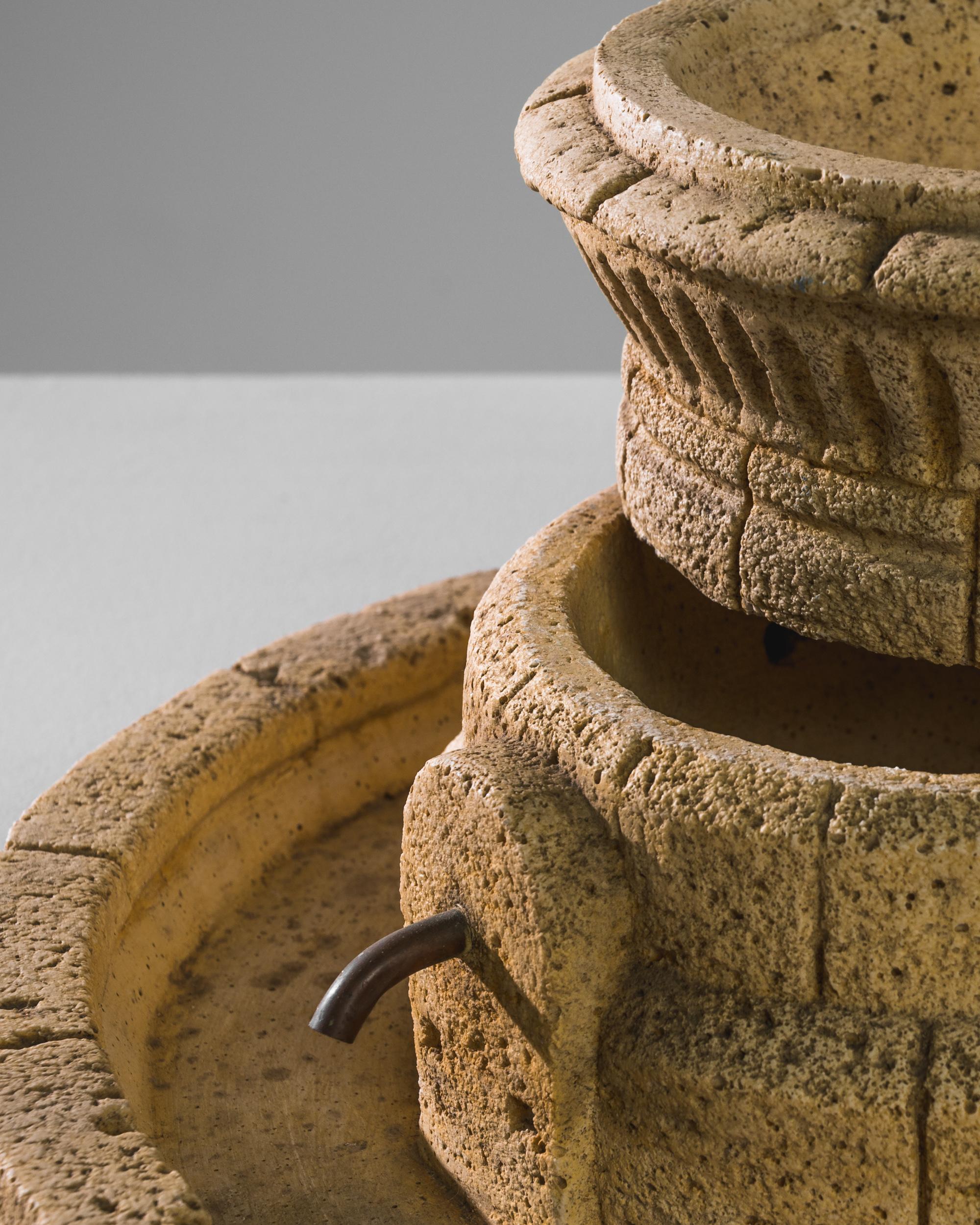 A concrete sculpture from Italy, produced circa 1970. A vintage sculpture formed from concrete shaped in the style of an ancient vase or coliseum. Featuring an open top and four spigots around its circumference, this charming piece appears as a