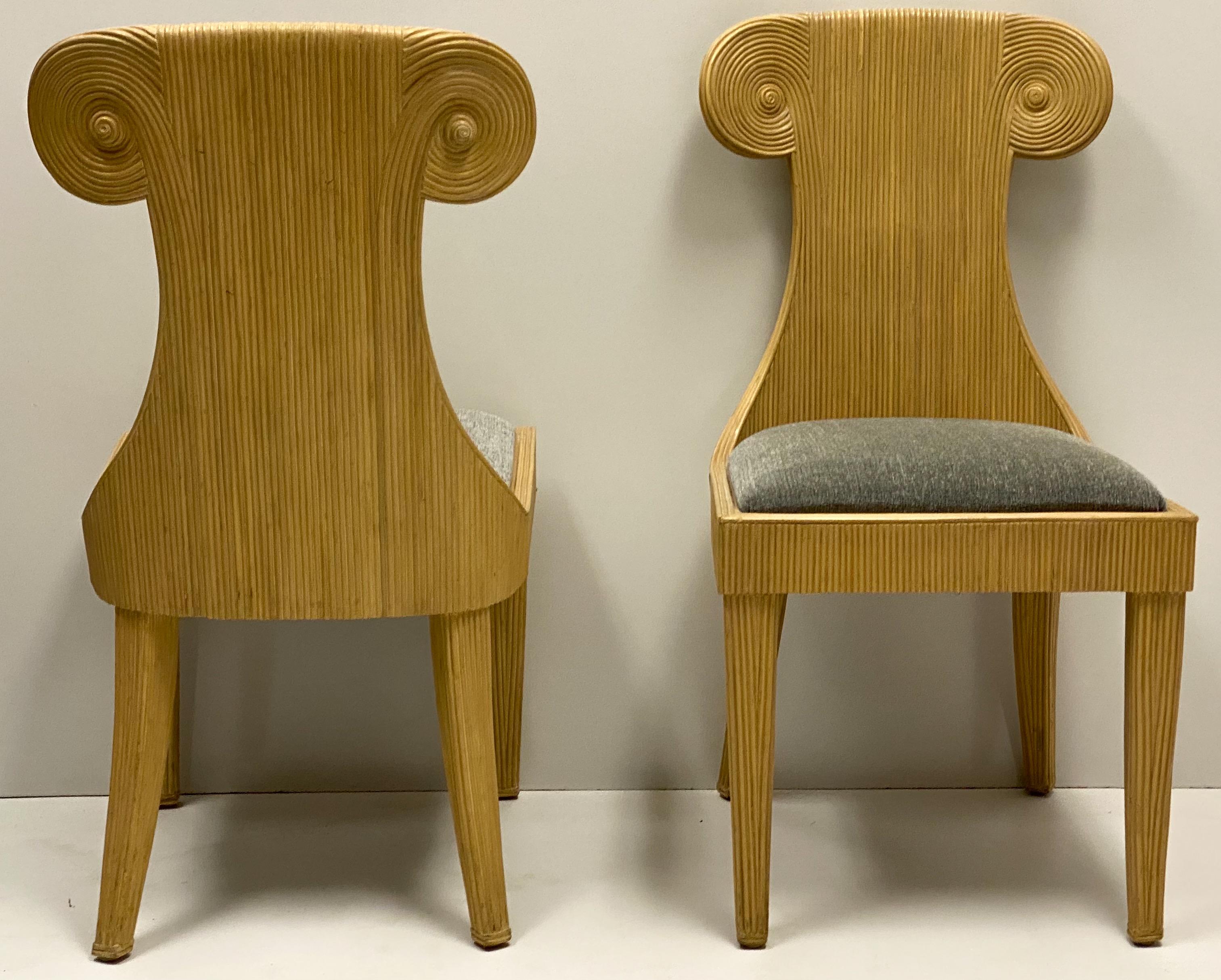 This is a set of four pencil bamboo chairs with an interesting Klismos form. They are in very good condition, including the vintage gray upholstery. They are unmarked.