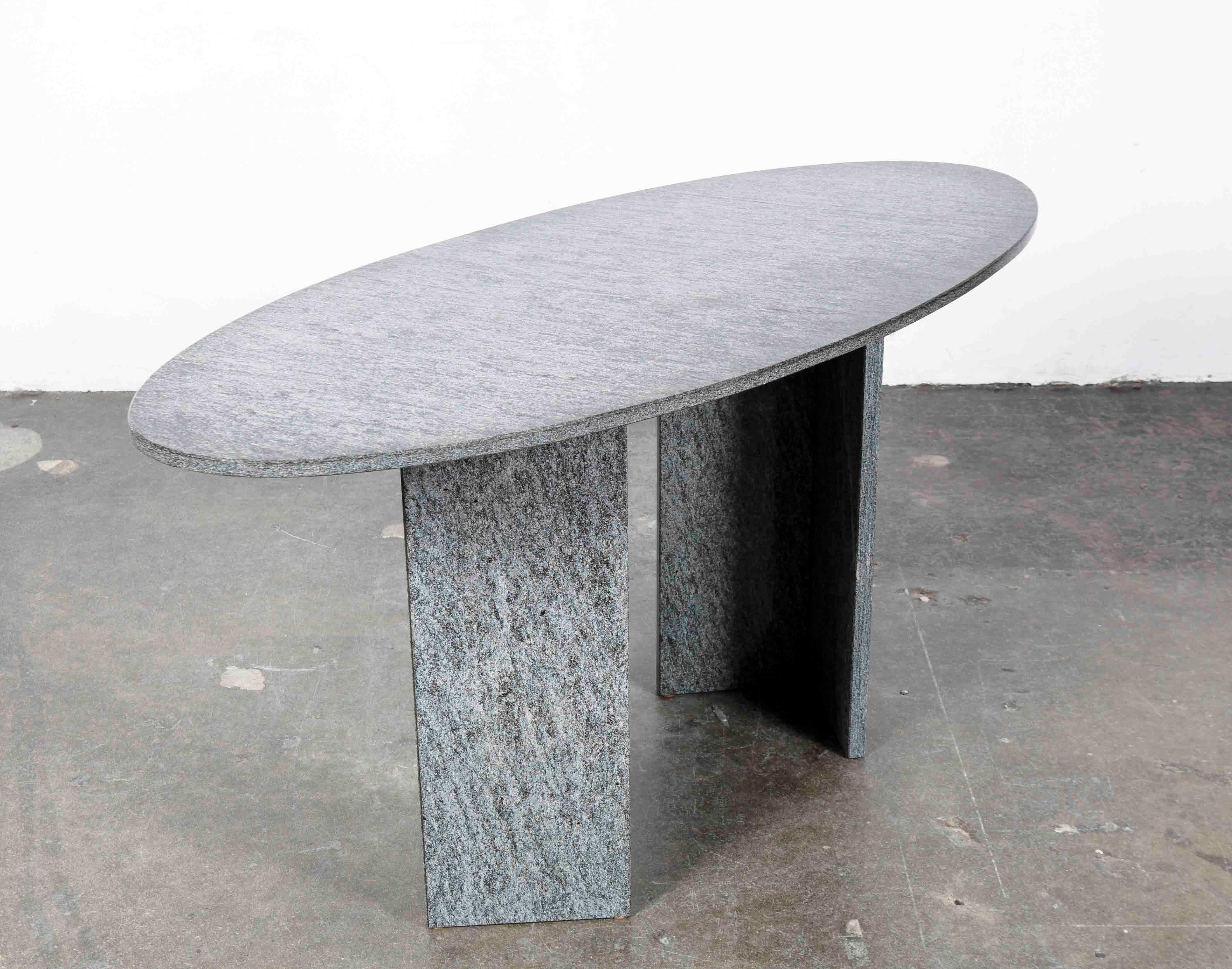 1970s Italian dark granite oval writing desk sitting on 2 adjustable 'V' shaped pedestal legs, can also be used as a console table.