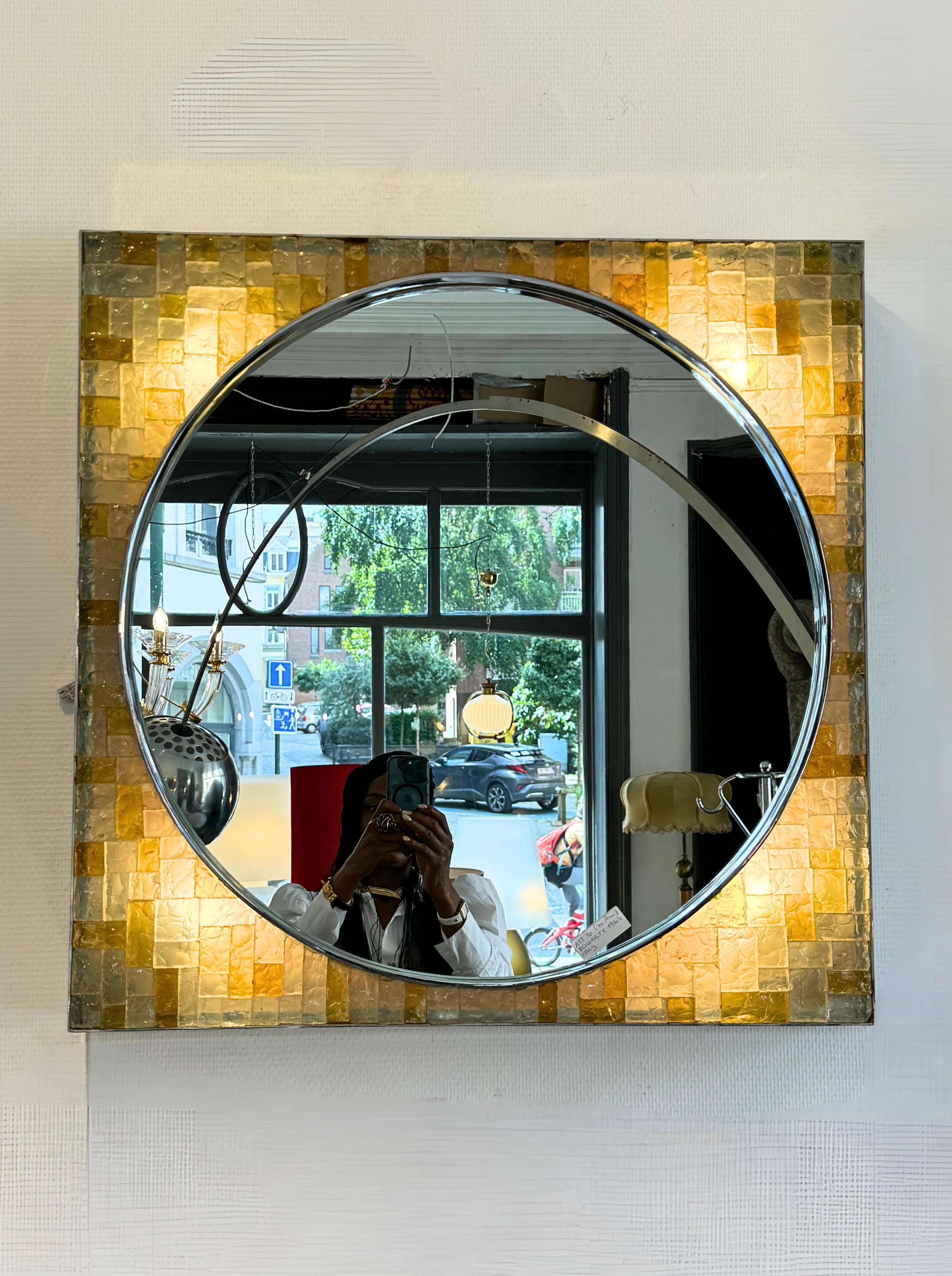 Vintage Italian design backlit wall mirror by Poliarte circa 1970s.
Featuring 4 light points behind a multicoloured glass mosaic frontal and framed by chromed steel.
The mirror is substantially large and gives off ambient lighting once