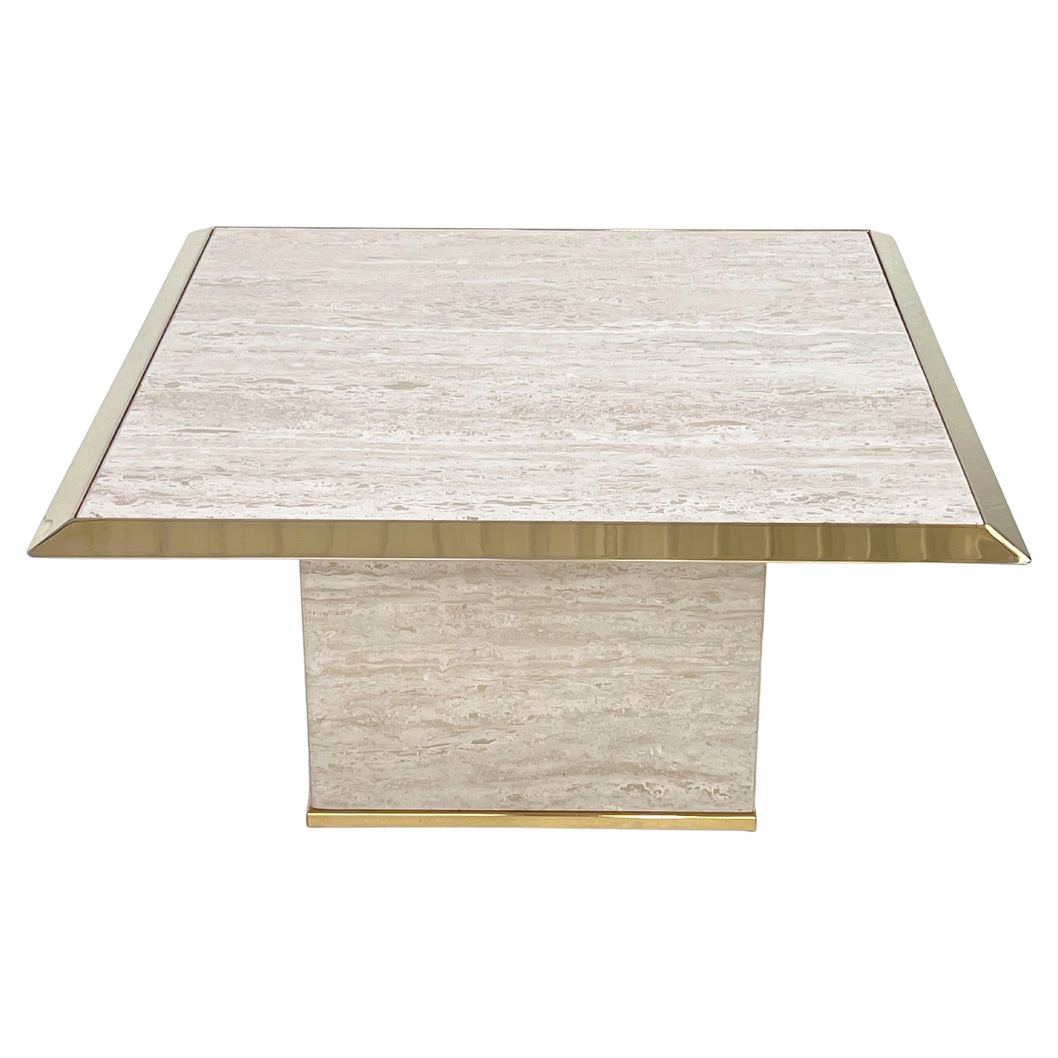 You will be seduced by the charm, the elegance and the presence of this 1970s Italian Design Hollywood Regency Style Travertine and Brass Coffee Table having an all structure in travertine underlined by a brass metal edging on top and base. All in