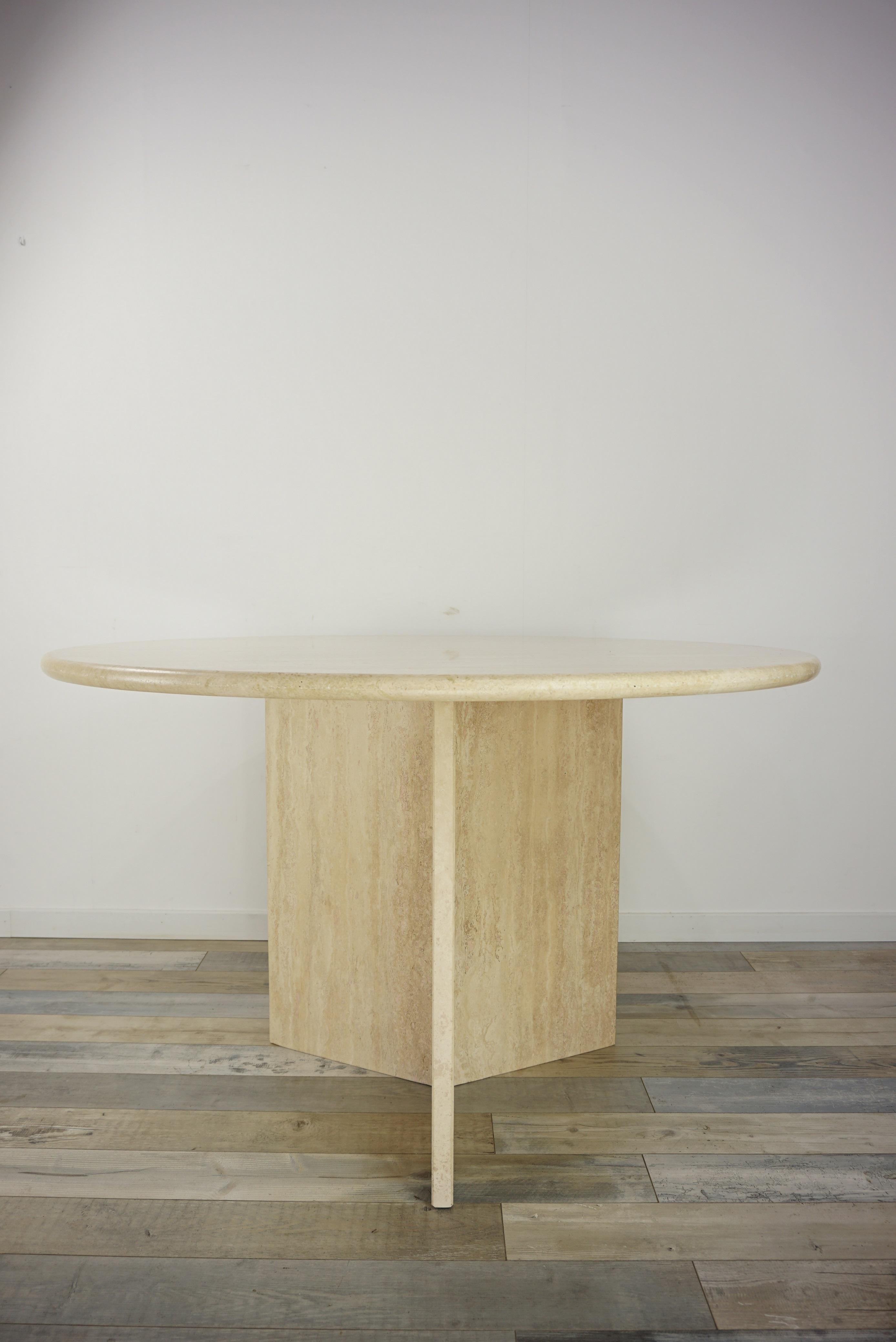 Italian design round pedestal table consisting of a graphic travertine and triangular foot with a round travertine tray.