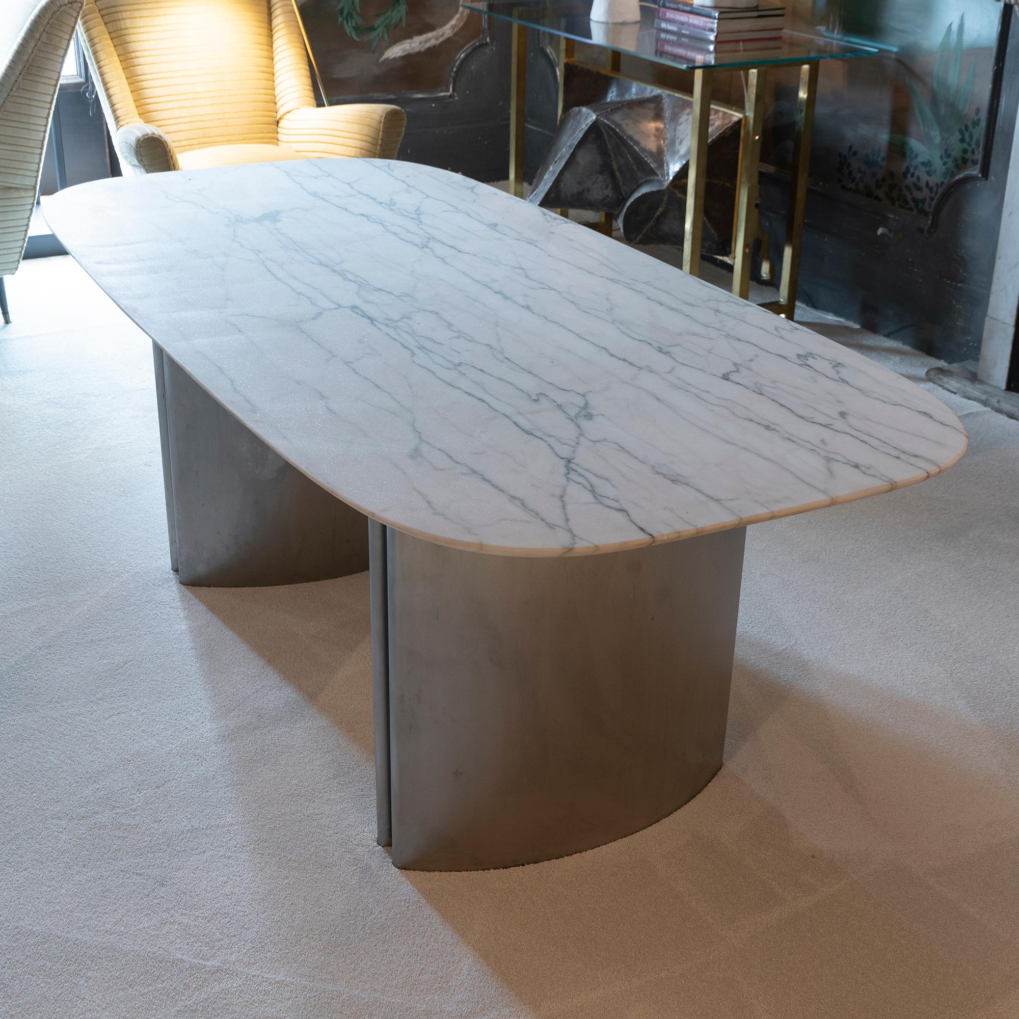 Dining table or center table consisting of two brushed chrome bases and a White Statuario marble top with a mat finish, perfect condition and vintage patina, really few missing pieces on the marble edges, Italy 1970,s circa.