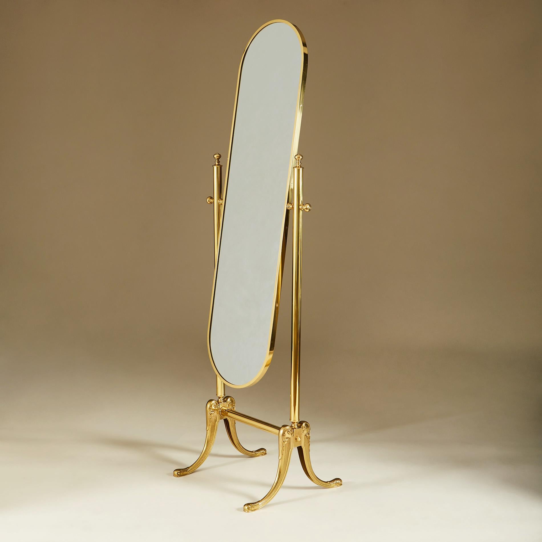 Brass full-length adjustable bevelled glass mirror with intricately-detailed cast brass splayed legs (see detailed image). Backed with green baize.