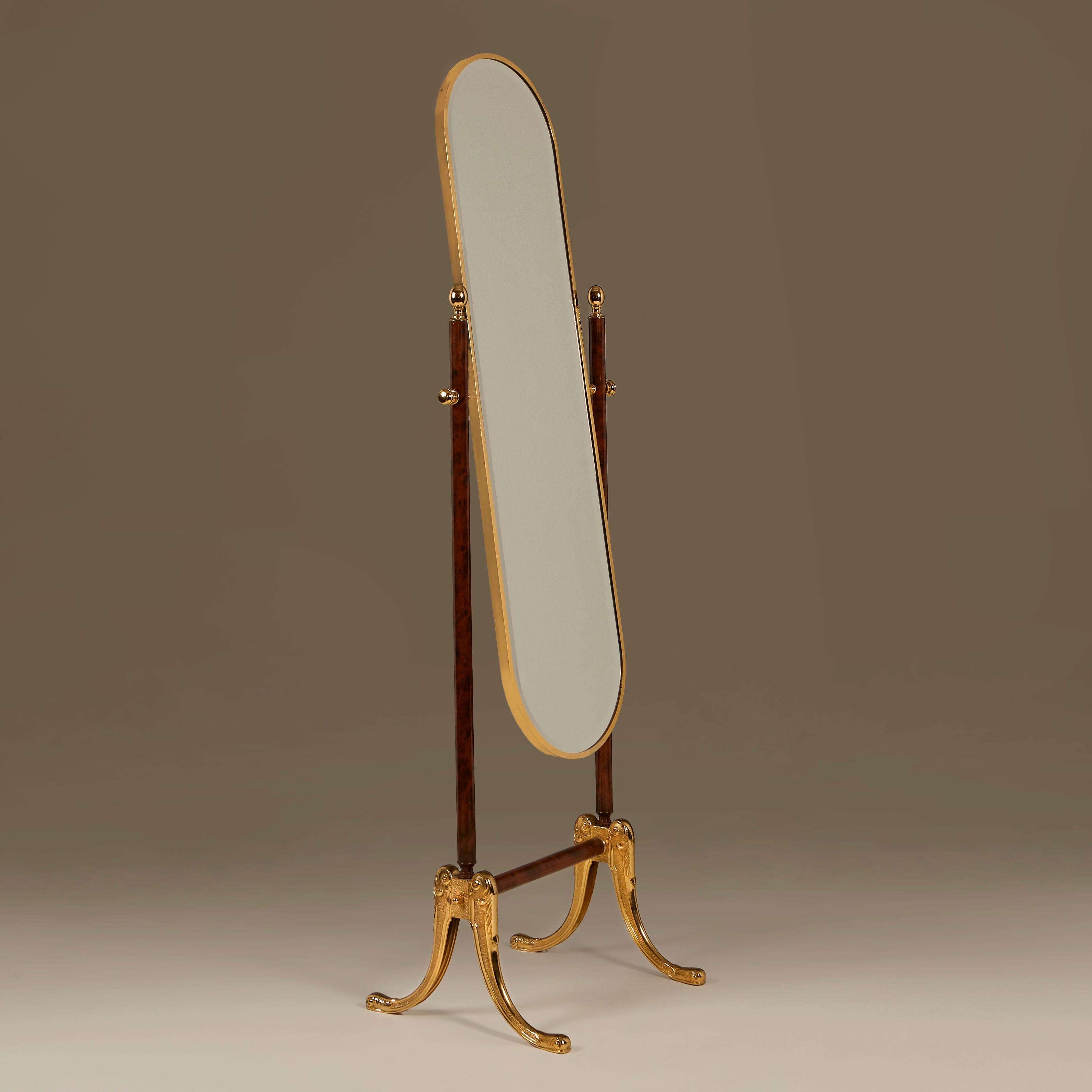 Chic dark faux wood and lacquered brass full-length adjustable bevelled glass mirror with intricately-detailed cast brass splayed legs (see detailed image).
