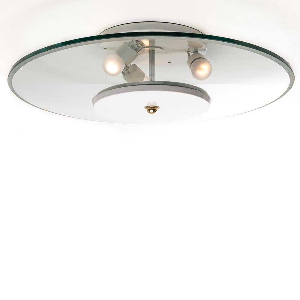 Such a sleek piece with the round beveled glass diffuser mounted on white metal frame. This semi Flush mount give a soft light through the room.