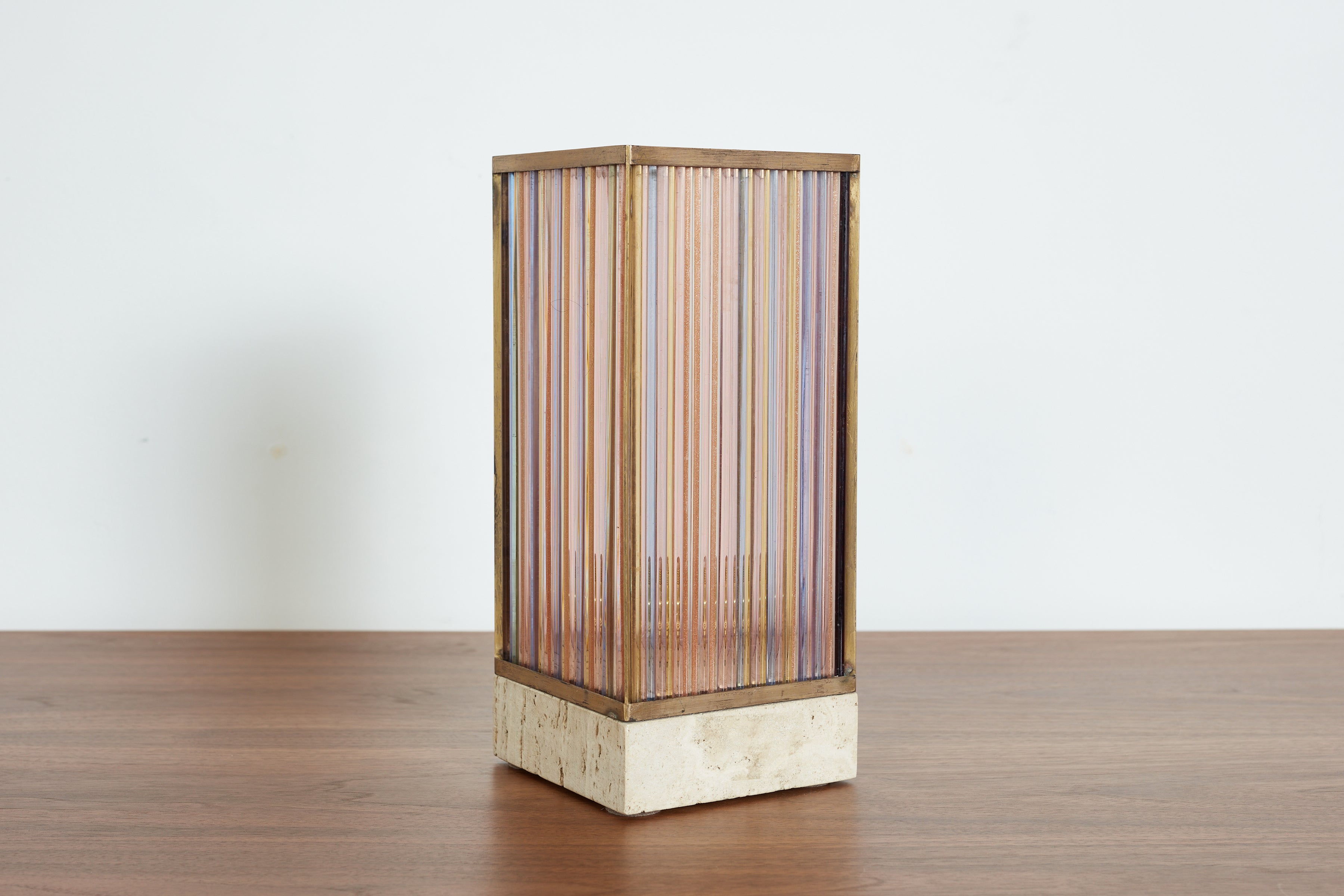 Fantastic 1970's Italian colored glass table lamp. 
multicolored glass strips sit on top of thick travertine base. 
Extremely well made. 
Italy, 1970's 