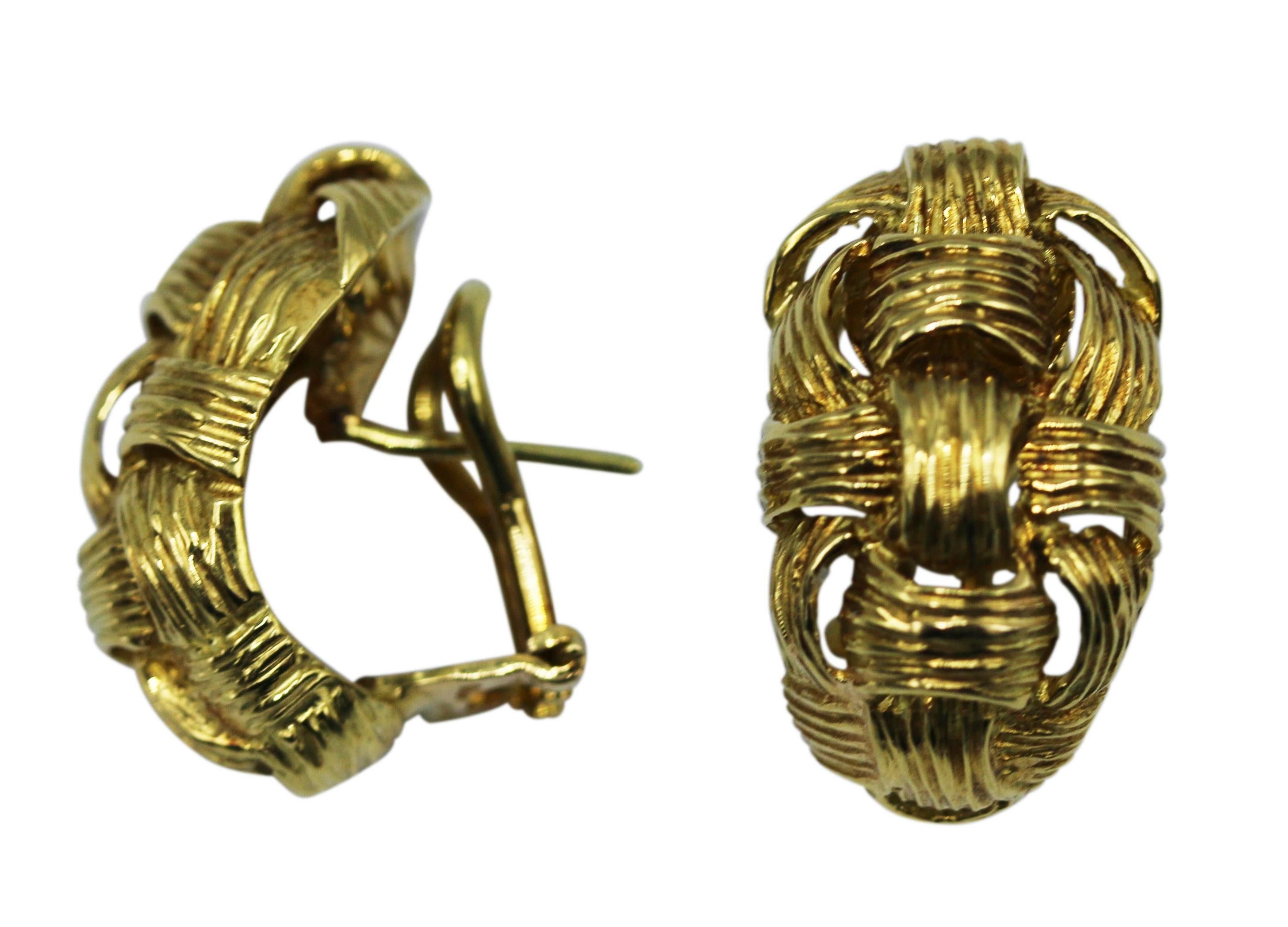 Pair of 18 karat yellow gold basketweave earclips, circa 1970, of half hoop-shape with a textured gold basketweave texture, gross weight 11.6 grams, measuring 1 by 5/8 inch, with Italian gold marks. A great pair of everyday earclips of unique design