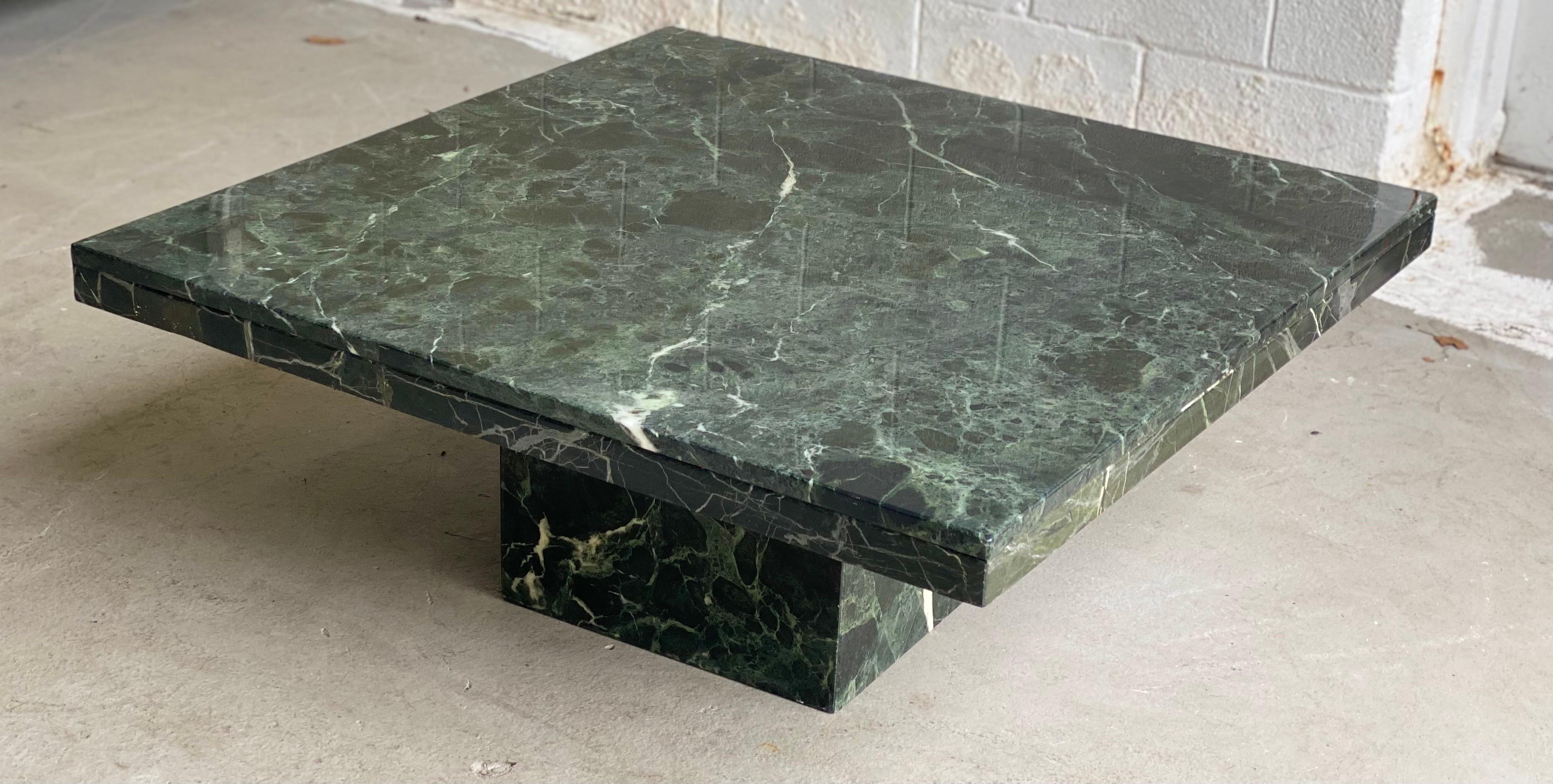 We are very pleased to offer a classic, monolithic stone coffee table, made in Italy, circa the 1970s. Made of a dark green marble with a laquear finish, this table is ideal to introduce a touch of color and character to a room. This architectural