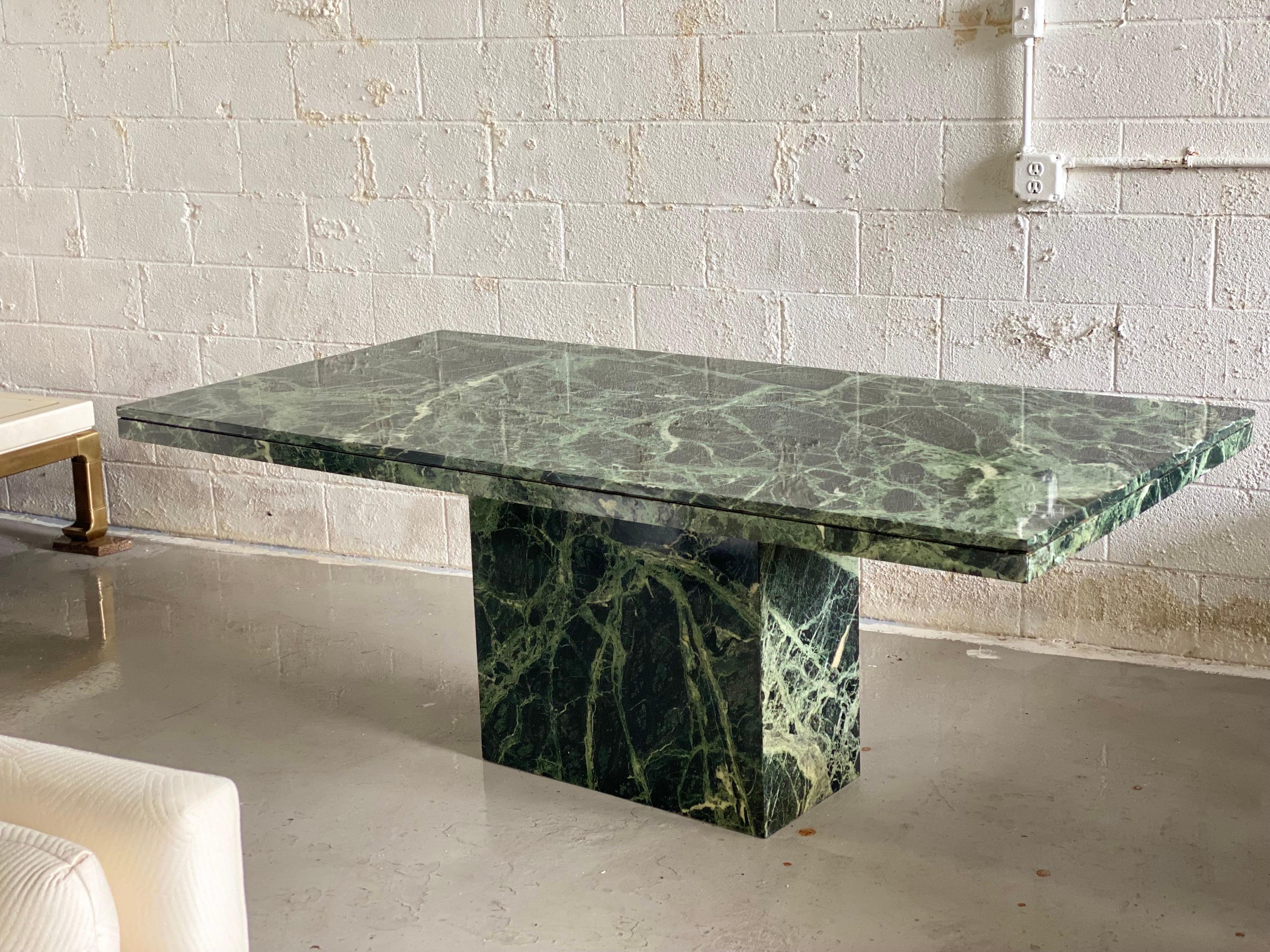 We are very pleased to offer a classic, monolithic stone dining table, made in Italy, circa the 1970s. Made of Green Verde Guatemalan marble, its name was given in reference to the dense forests of Guatemala, the different green tones of the