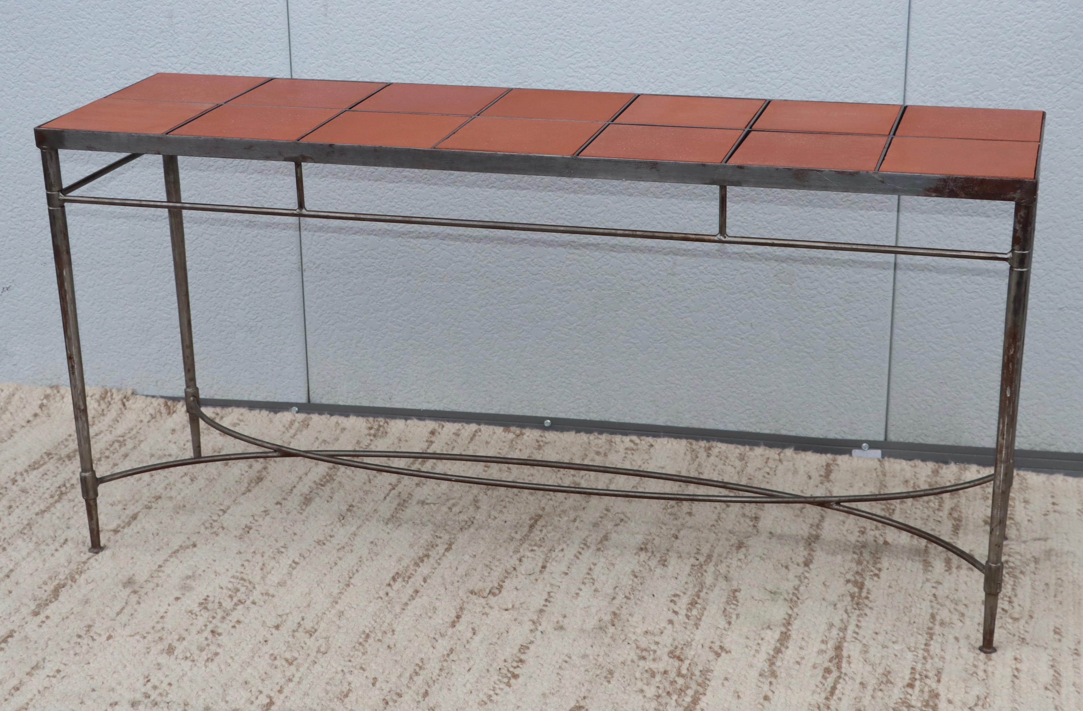 1970's Solid iron well made Italian console with Impruneta terracotta tile inserts, in vintage original condition with some wear and patina due to age and use.