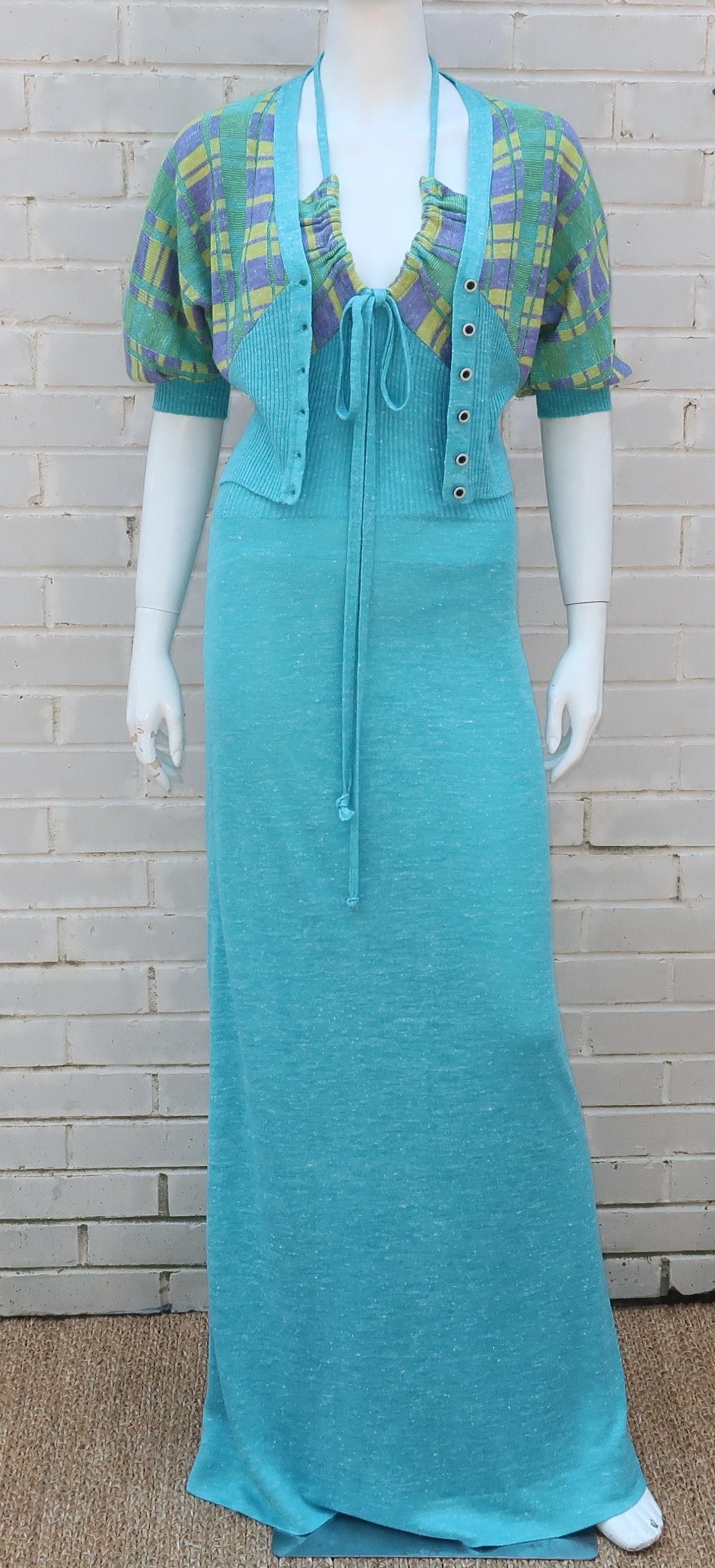 This 1970's Italian knit maxi dress by ORA has a dual personality ... demure with the coordinating sweater jacket and completely sassy without!  The dress has a pullover halter construction with a tie and ribbed section at the bust.  The cropped