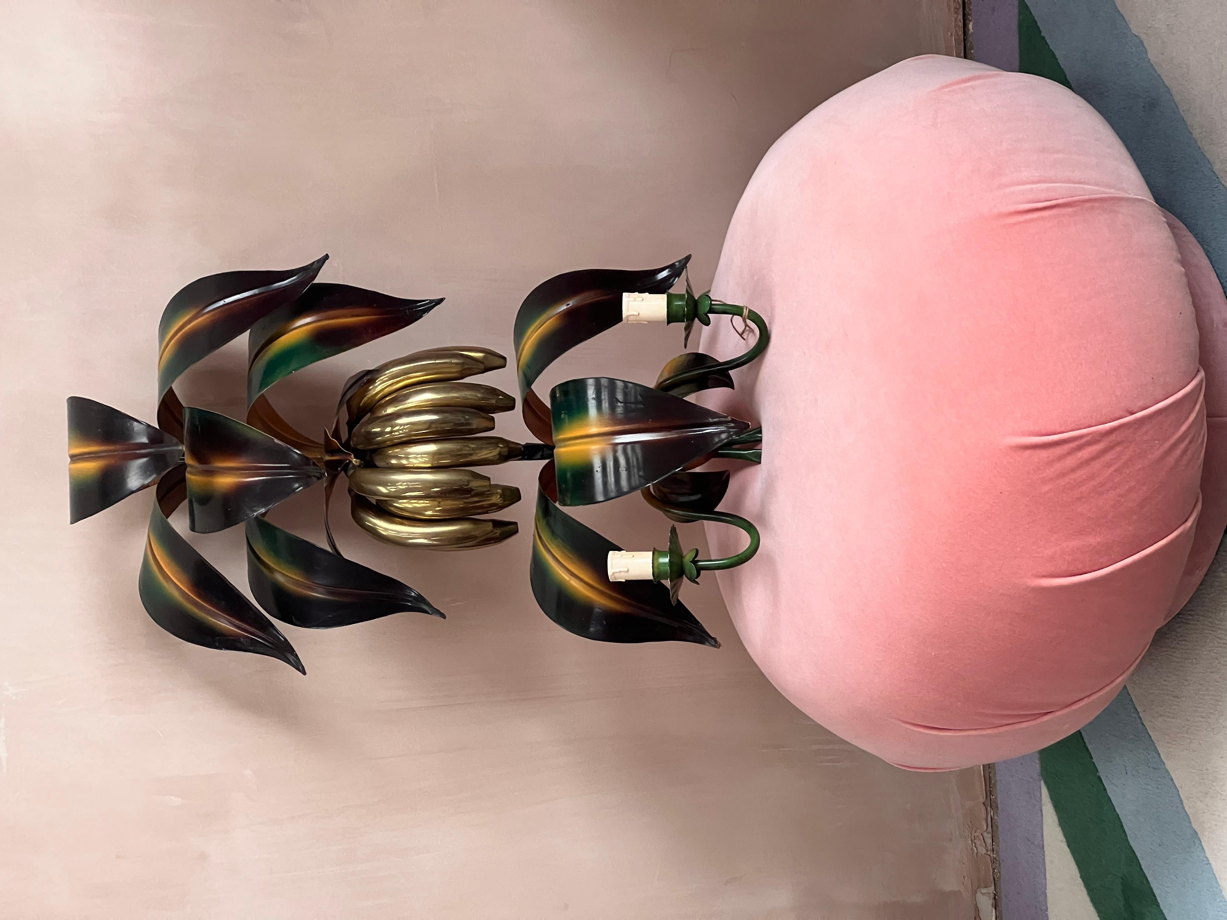 Rare 1970s Italian banana wall light. 9 leaves hand painted with a large bunch of brass bananas in the center. Two arms at the bass of the light that hold bulbs and shades. Loop to the top of the light at the back for easy hanging on the wall.In