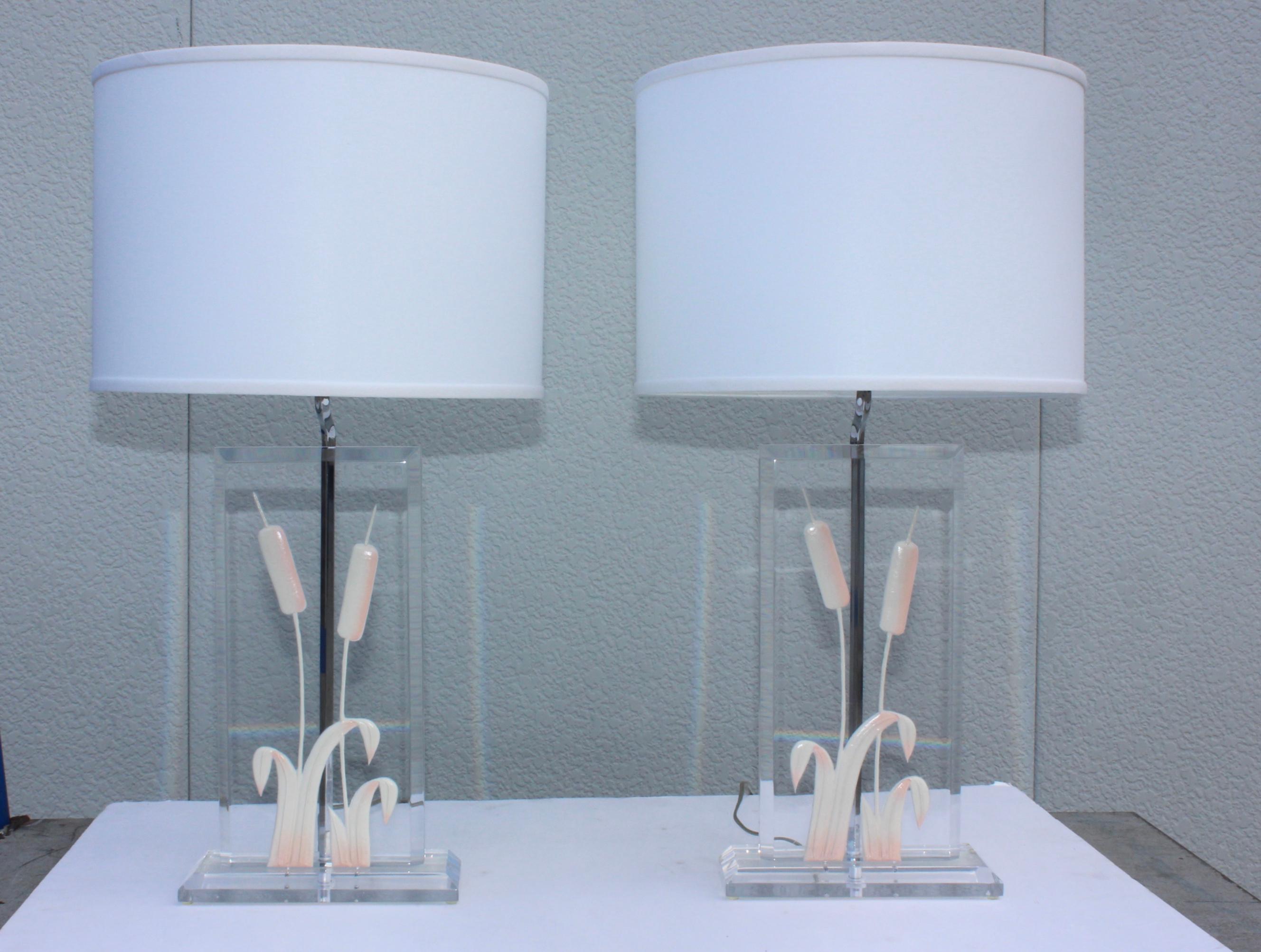1970s modern Italian Lucite table lamps. With cattail detail and chrome hardware.

Shades for photography only.