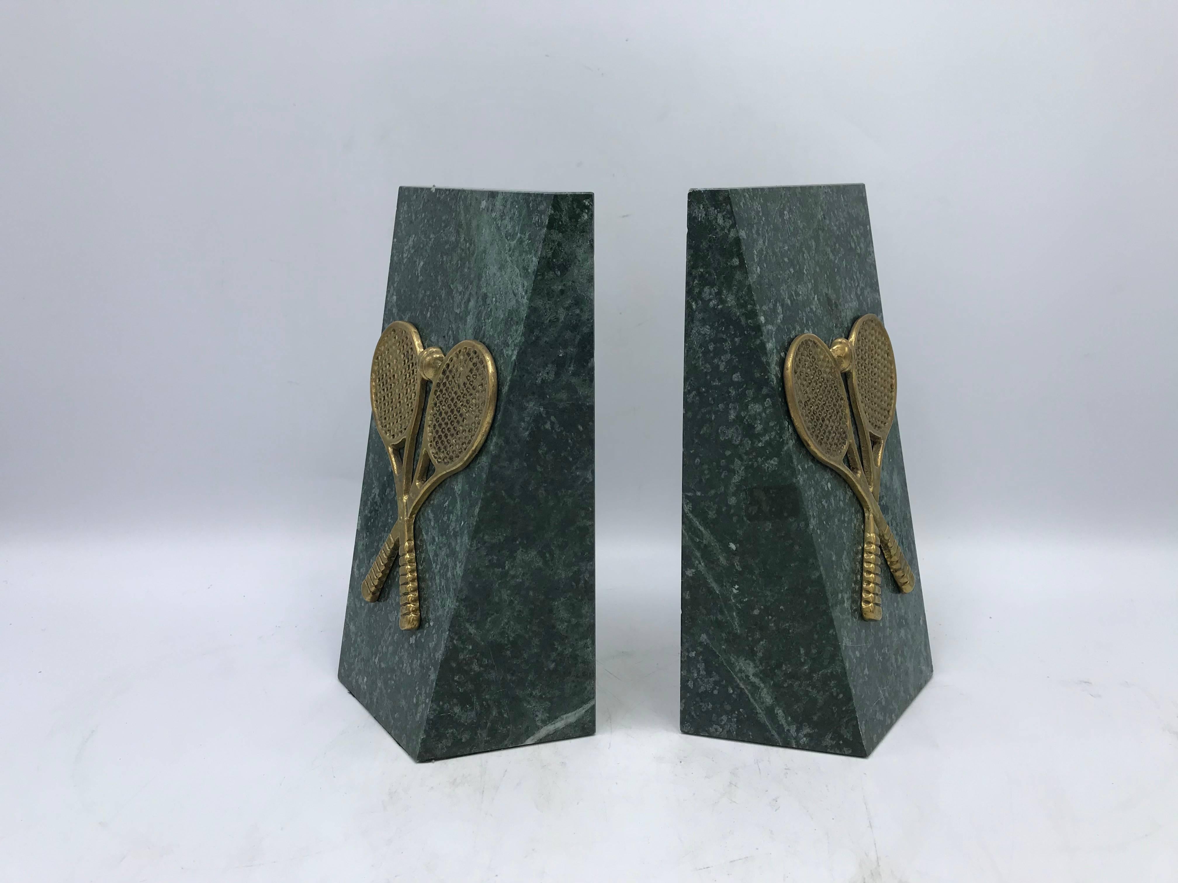 Listed is a stunning and substantial, pair of 1970s Italian marble bookends. The pair has brass tennis racket sculptures on each, perfect for any tennis enthusiast or sports den! Heavy, weighing 5.5lbs/each (11lbs/pair).