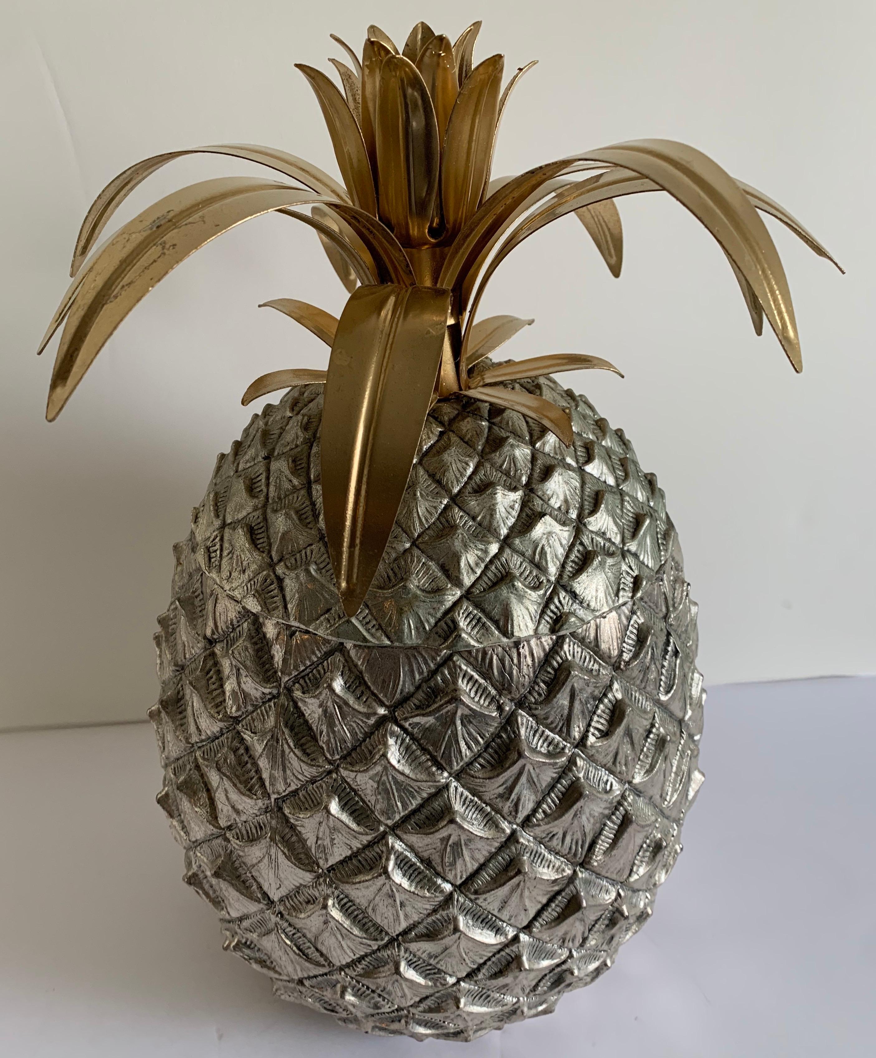 1970s large Mauro Manetti pineapple ice bucket. Hammered silver pineapple with original plastic liner. Brass and gilt metal fronds. Signed on the underside. Made in Italy.