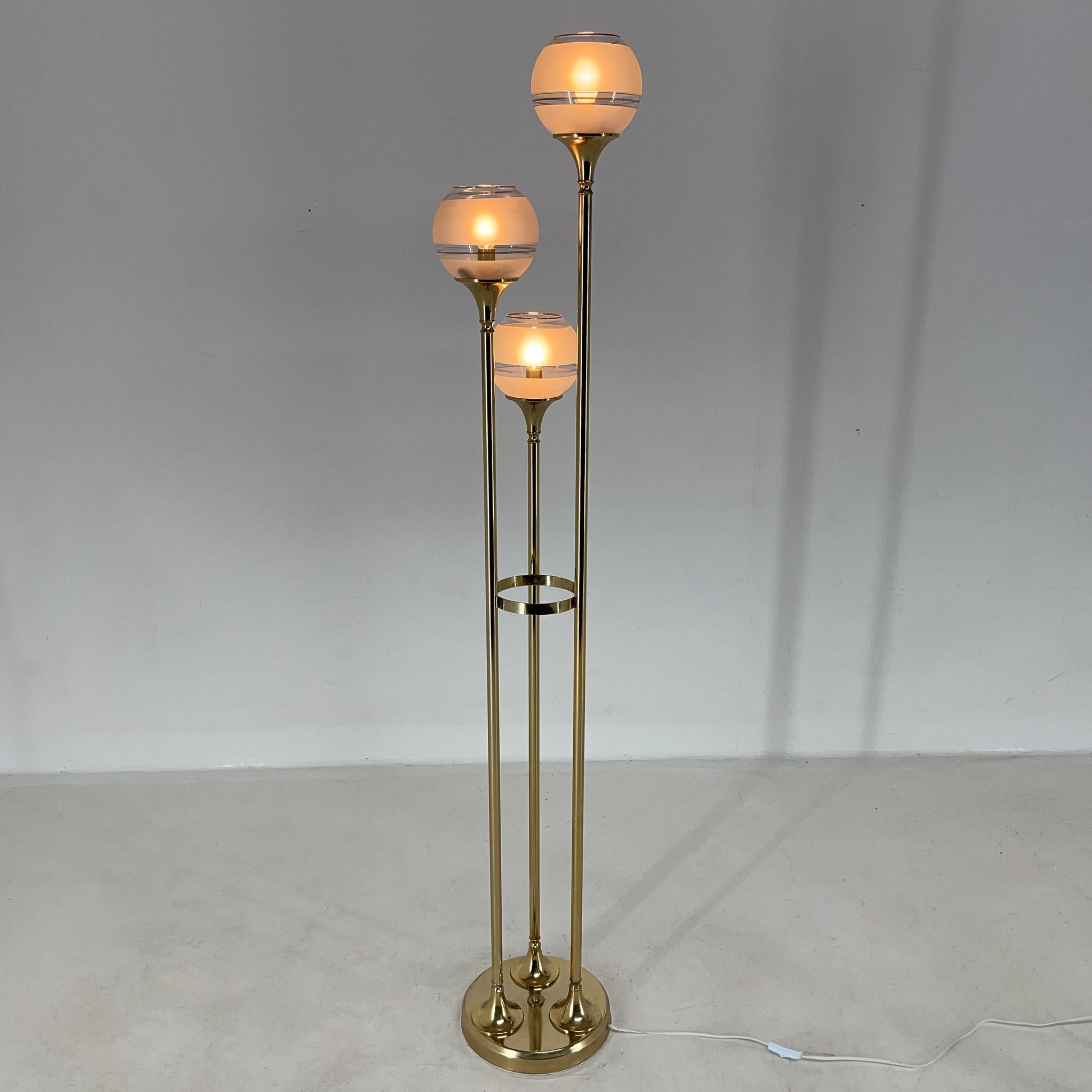 Vintage floor lamp made of light metal in golden colour with three glass bowl lamp shades. In very good original condition (see photo), made in Italy in the 1970's.