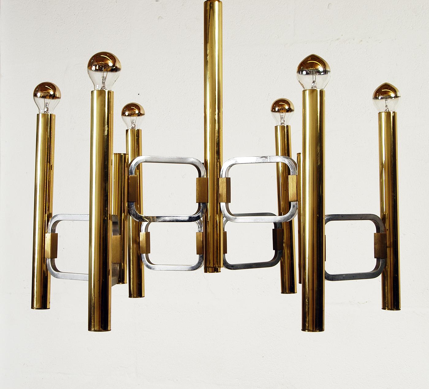 A rare 1960s Modernist chandelier by Profili Industria Lampadari, Rome, Italy as part of their 'Modulo Series', with the distinctive radiused square rings that were made in either satin brass or chrome - this piece has the chrome example. (See the