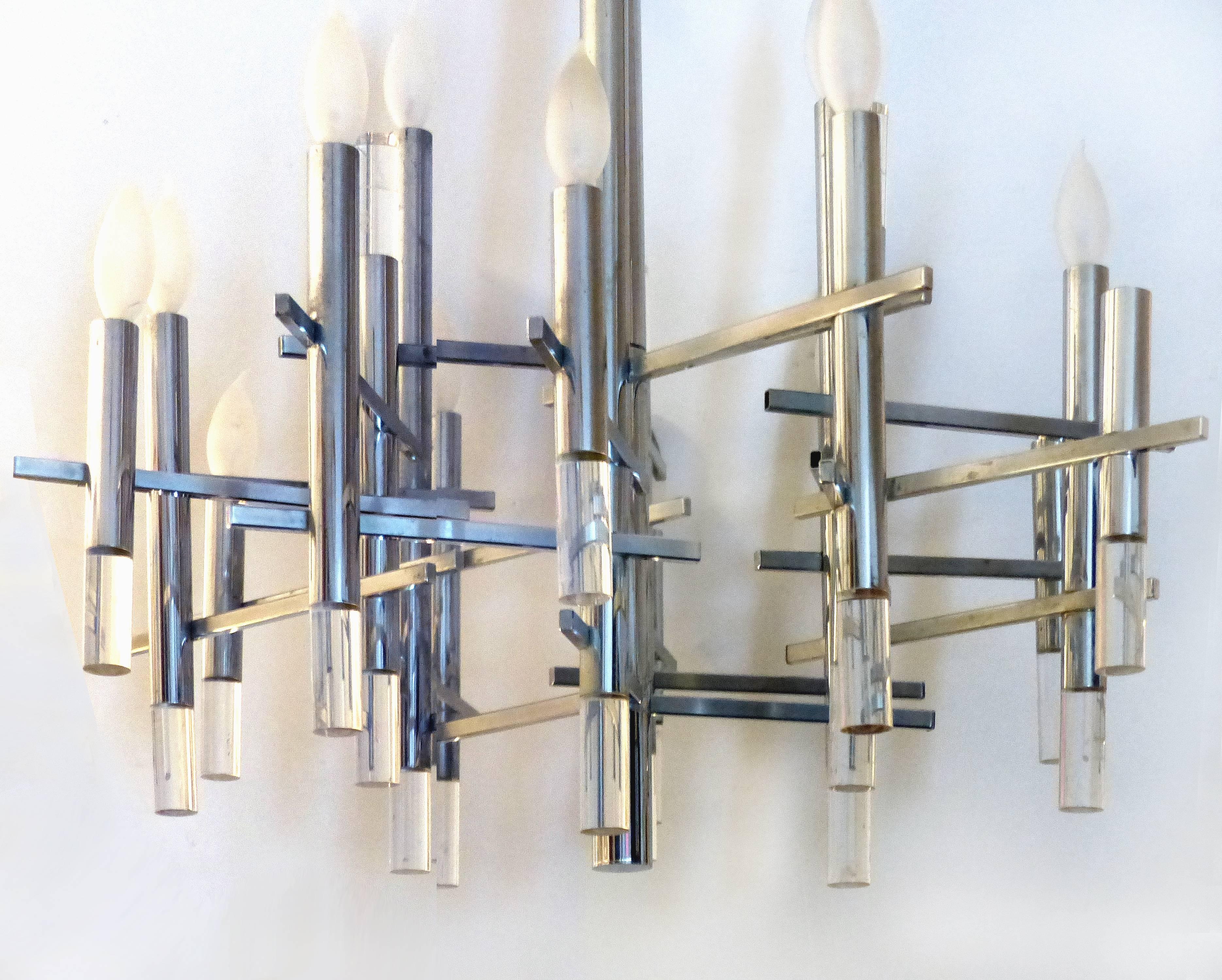 Gaetano Sciolari Italian Modernist Chrome Chandelier

Offered for sale is a 1970s modernist chandelier by the Italian lighting designer Gaetano Sciolari created in an angular geometric design. The vertical chrome tubes support sockets above and