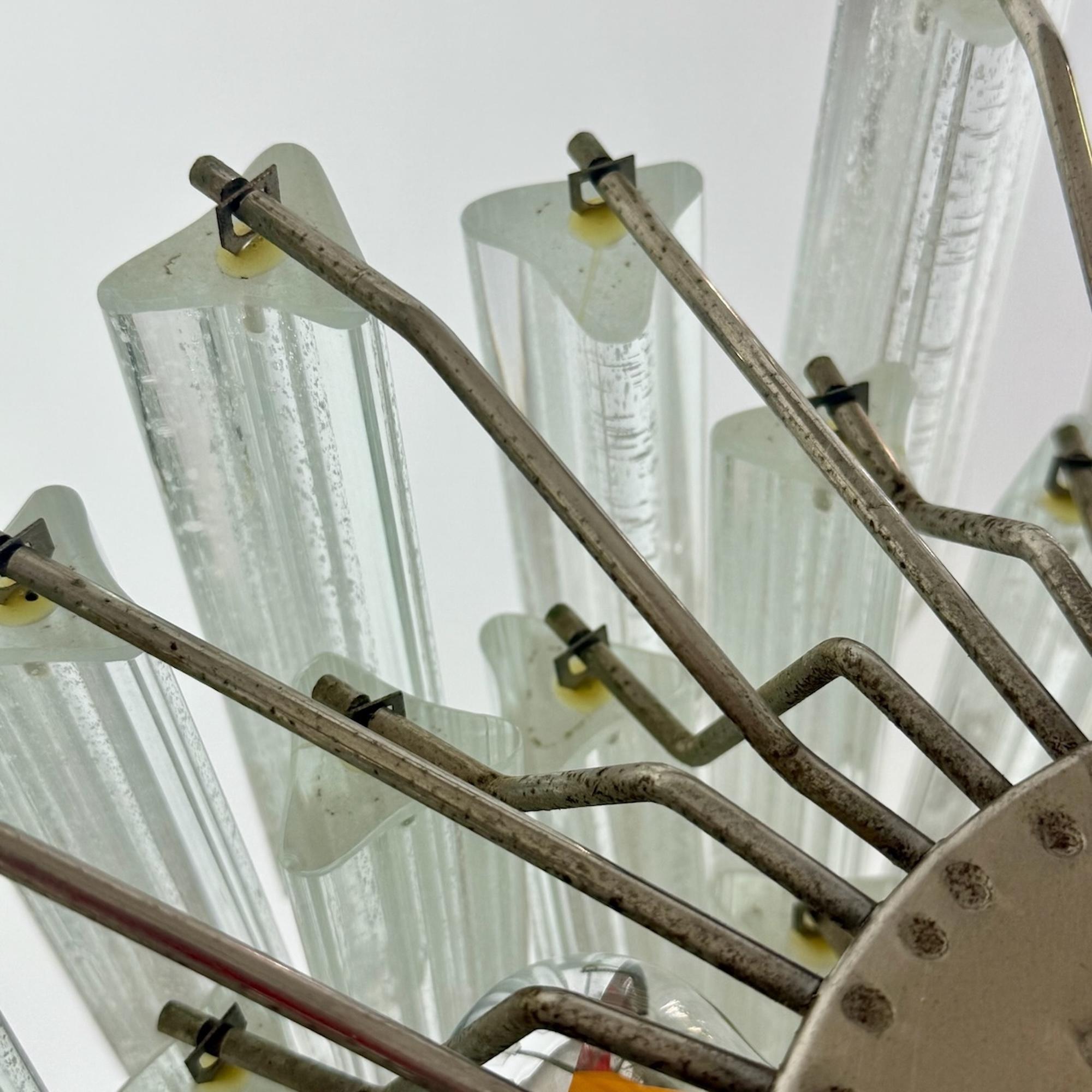 This exceptional 1970s Italian Murano chandelier features 84 hand-formed trilobal glass prisms, a characteristic motif of late-mid-century Venetian glassmaking. 

The prisms are richly textured, allowing the fixture to cast a soft, refracted glow