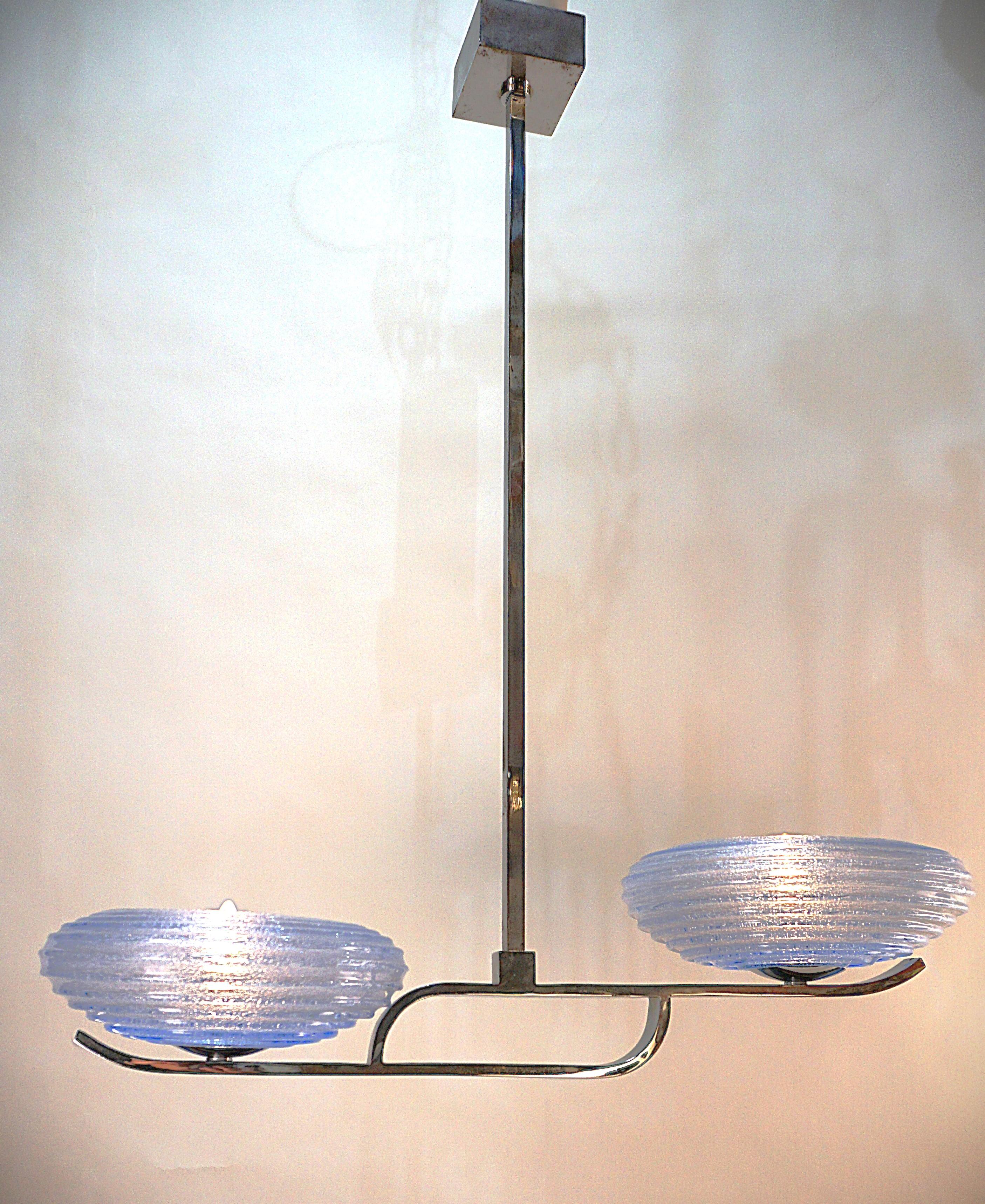 Hand blown Murano glass shades and chrome on bronze frame 1970's modern chandelier.
Professionally rewired and ready for installation.
Two lights, 150watts max each.
Hight can be shortened, let us know if you like to adjust the height.