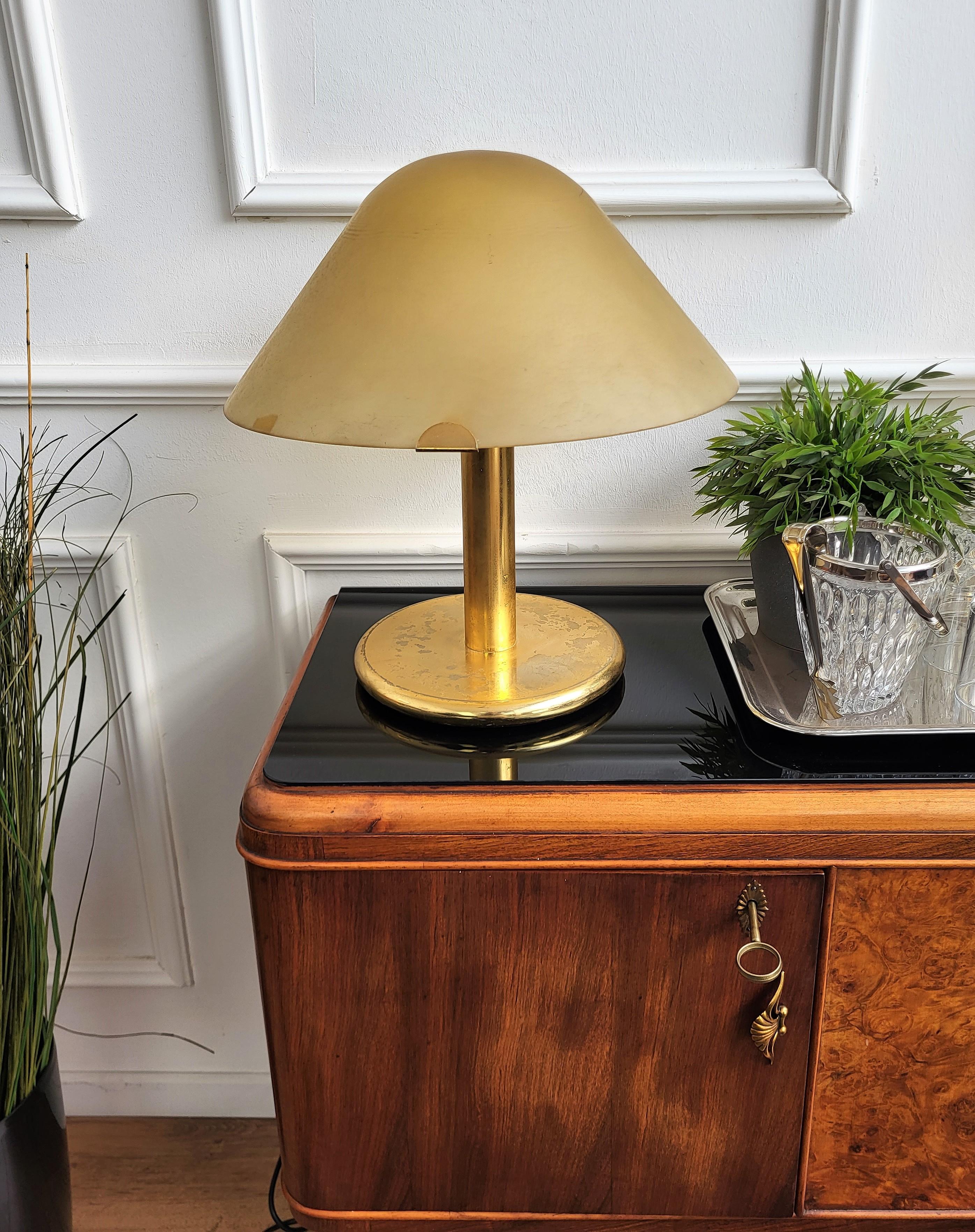 Iconic pair of large 1970s Murano glass shade table lamps. As can be seen from pictures, the metal and glass are in good structural condition, with the glass showing a typical coloring from handproduction and the brass having some minor fading and