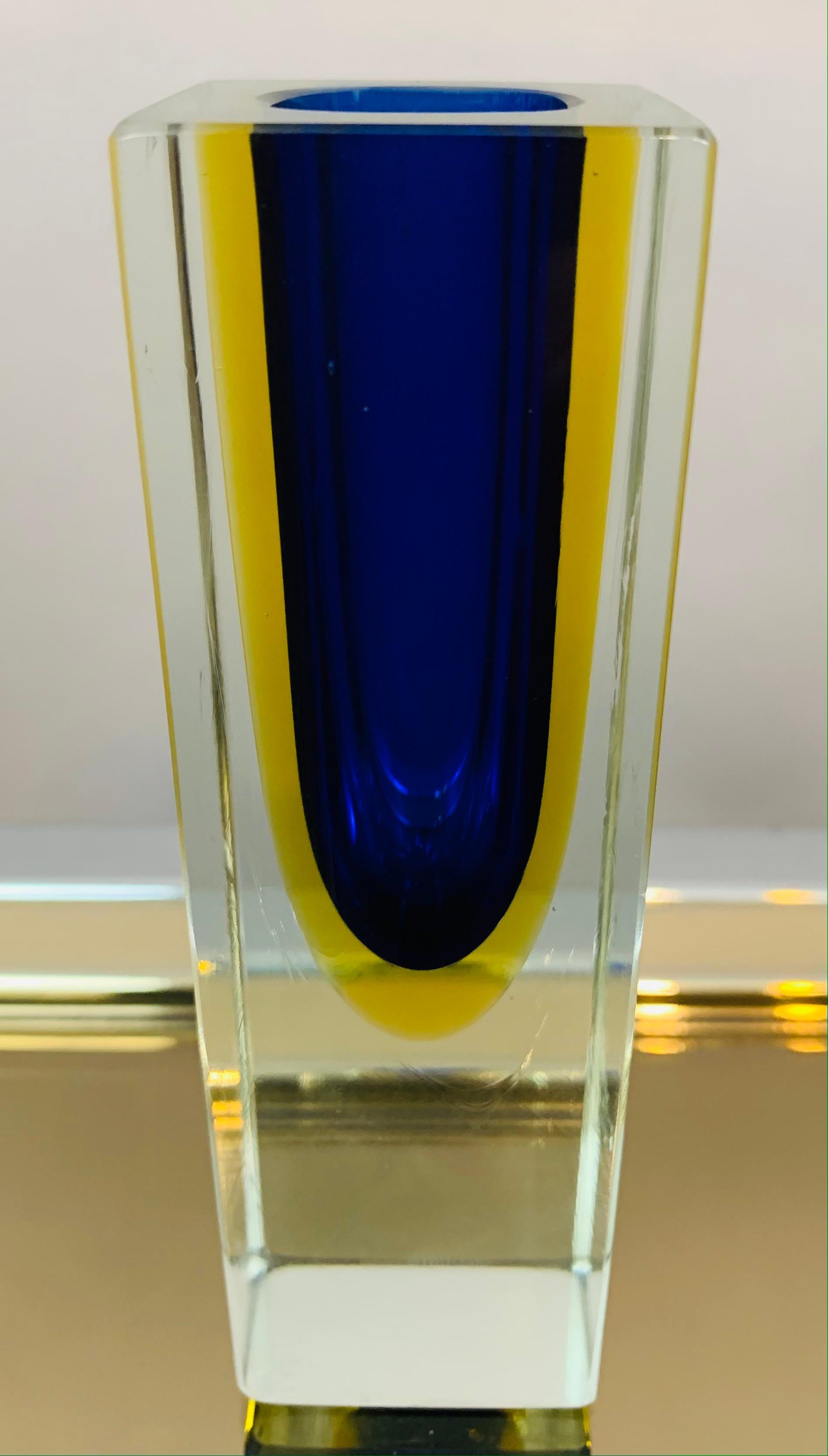 1970s Italian, Murano, hand blown, sommerso - blue, yellow and clear small rectangular glass vase. A beautiful decorative piece perfect for a glass display case or shelf where the light can shine through it. The vase has been cut and polished with a