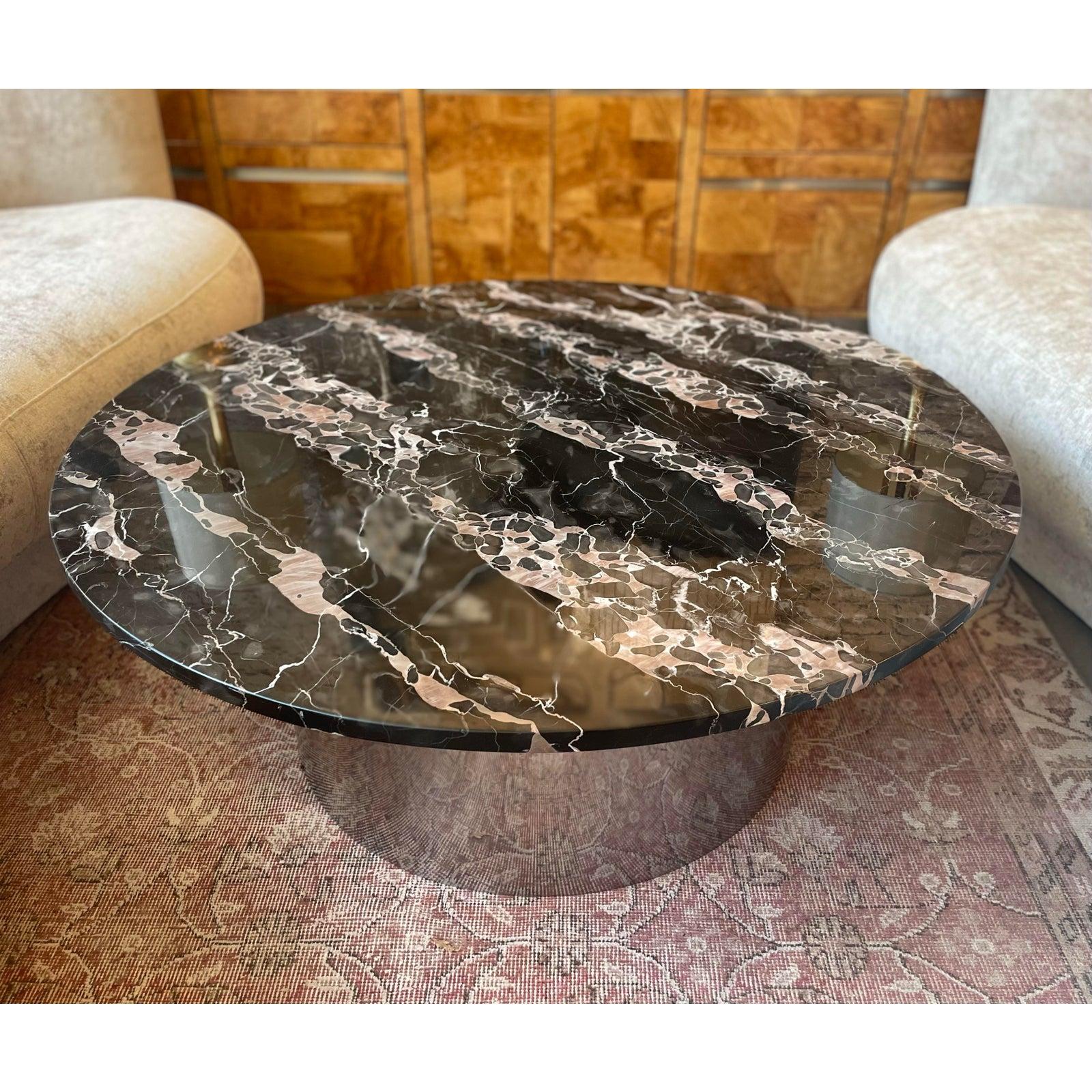 Absolutely stunning piece of marble over a chrome base. Usually Nero Portoro has gold/orange veining but this is more blush pink. It’s truly beyond.

DIMENSIONS: 42ʺW × 42ʺD × 17ʺH
STYLES: Italian
TABLE SHAPE: Round
PERIOD:1970s
COUNTRY OF ORIGIN: