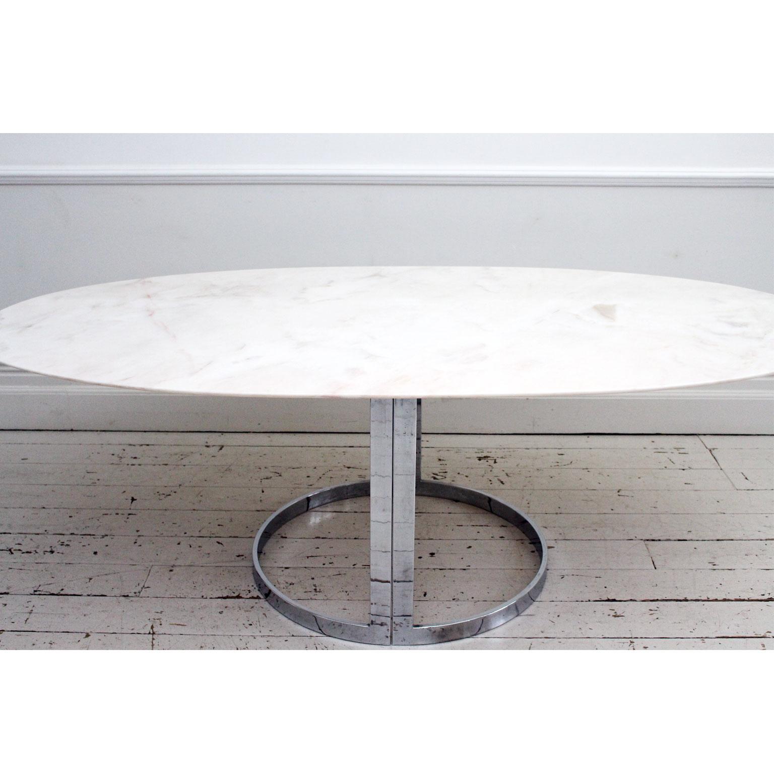 This 1970s Italian table is everything a dining table should be. Sleek, chic and beautiful. The oval Portuguese Rosa marble top is exquisitely Fine - it has lovely pinky tones running through the white background. The two part chrome base is