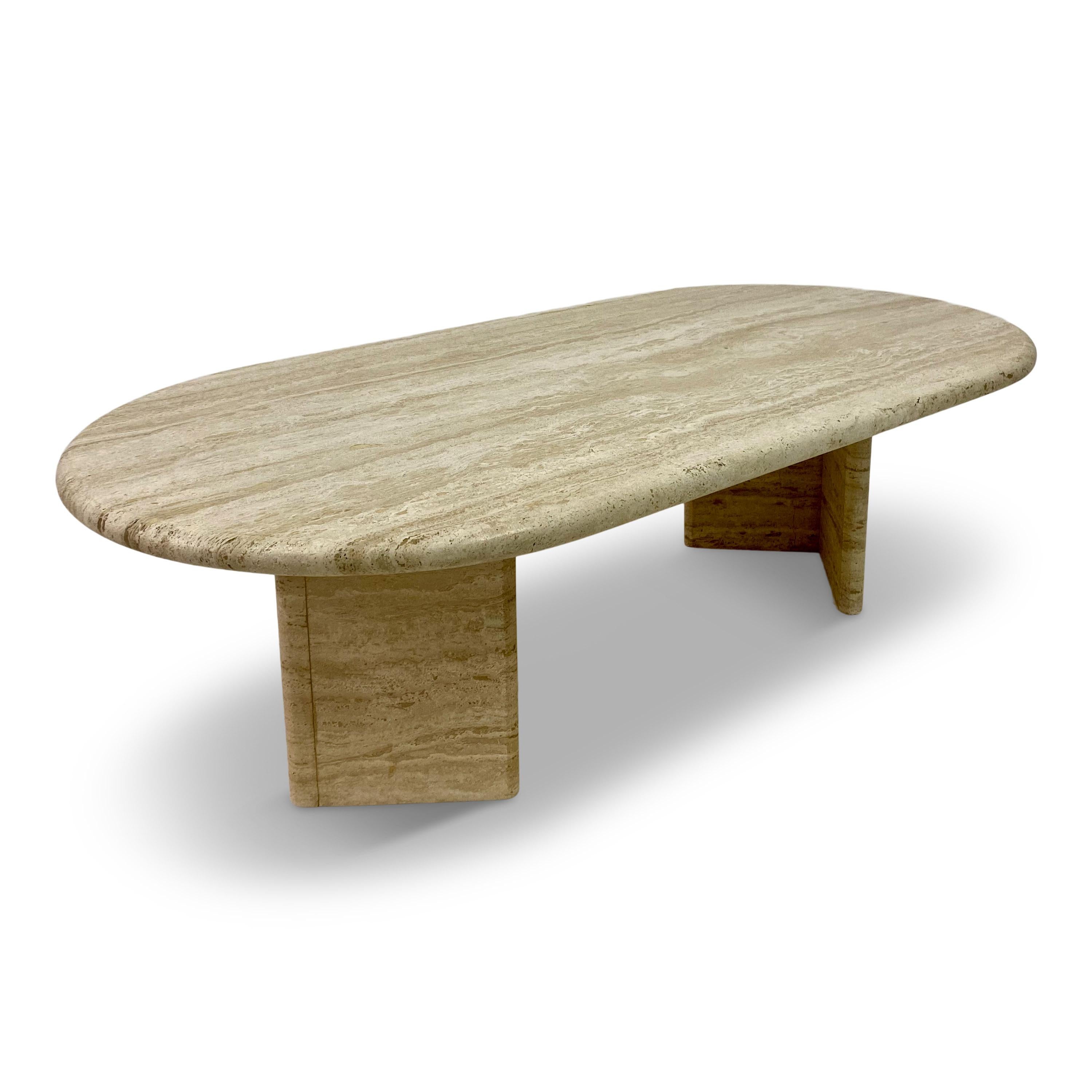 Oval coffee table

Travertine

Two angled base supports

Italian 1970s/1980s.