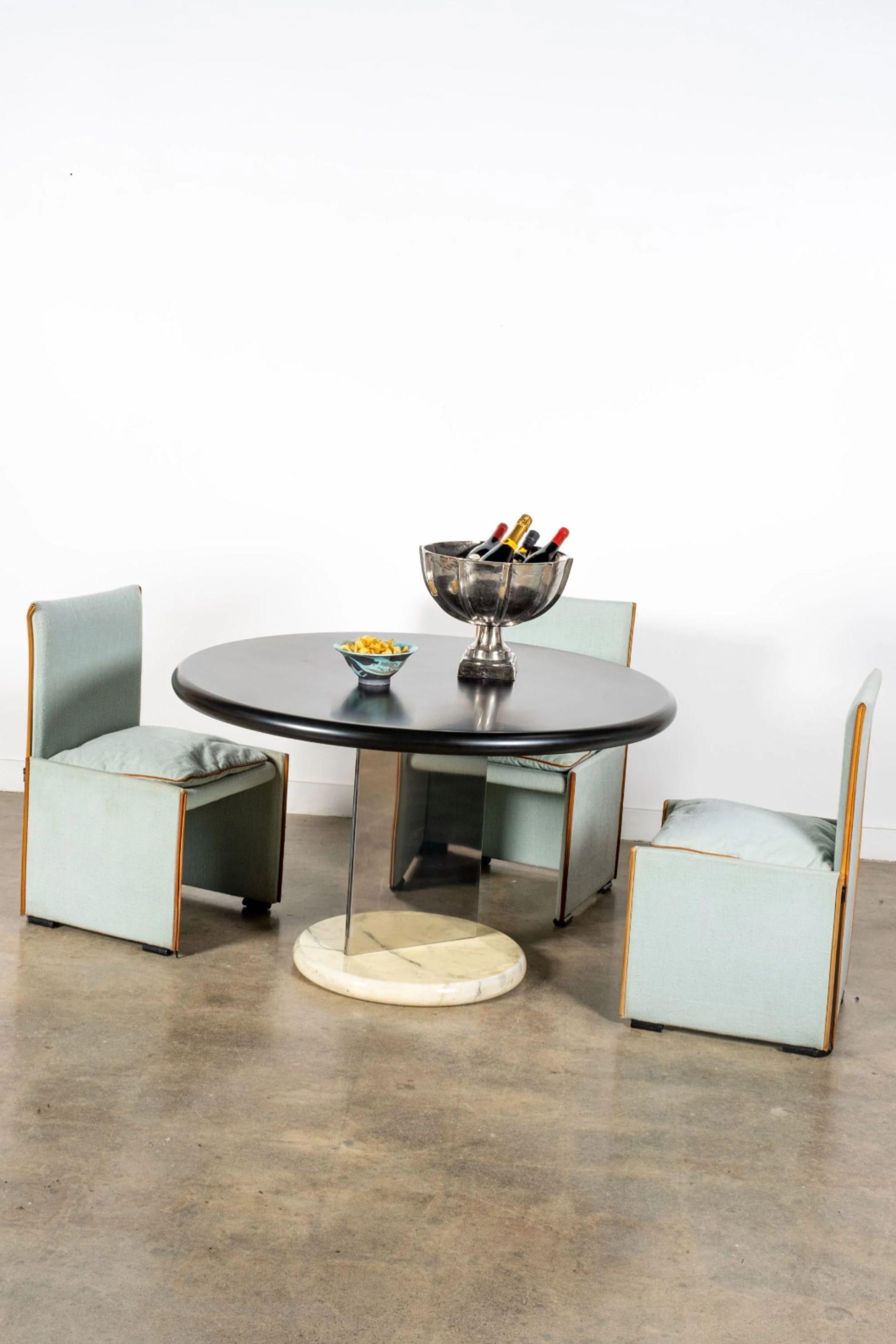 Mixing materials has powerful rewards. Look no further than the ebony, steel, and marble trifecta of this dining table. Attributed to Italian designer Giotto Stoppino (1926 – 2011), this piece epitomizes Seventies glamour and is sure to make the