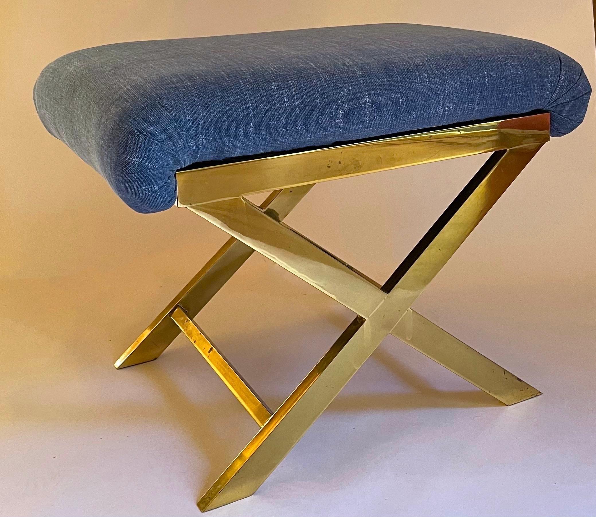 1970s Polished brass X-bench. Newly upholstered in Jane Churchill denim blue printed cotton fabric.
No makers mark or brand stamp. The bench is heavy and well made.