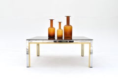 1970 Table basse italienne Renato Zevi en chrome, laiton et verre fumé