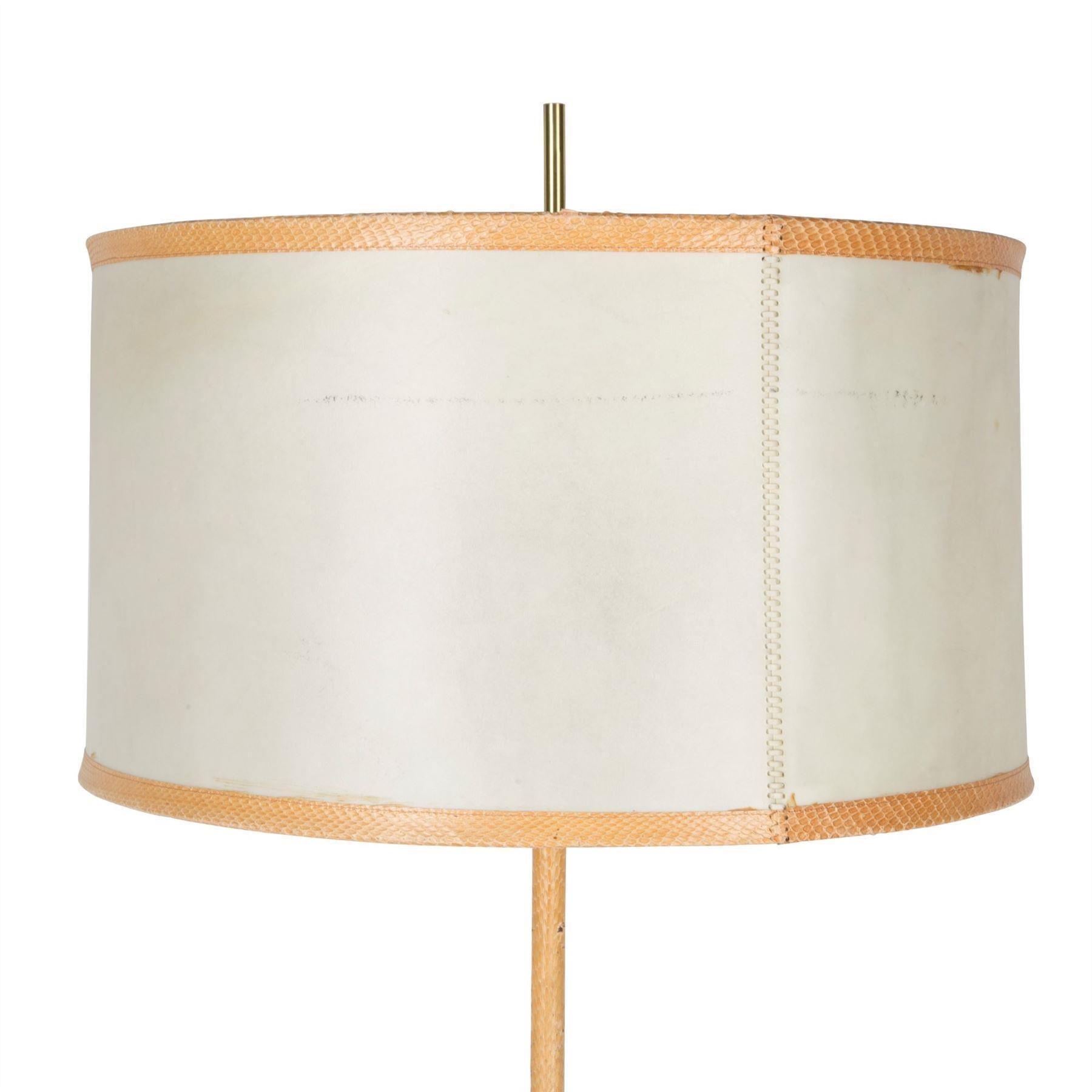 Faux snakeskin leather covered standard lamp with original parchment shade. Italian, circa 1970.

Shade dimensions: H: 29cm x D: 50cm.