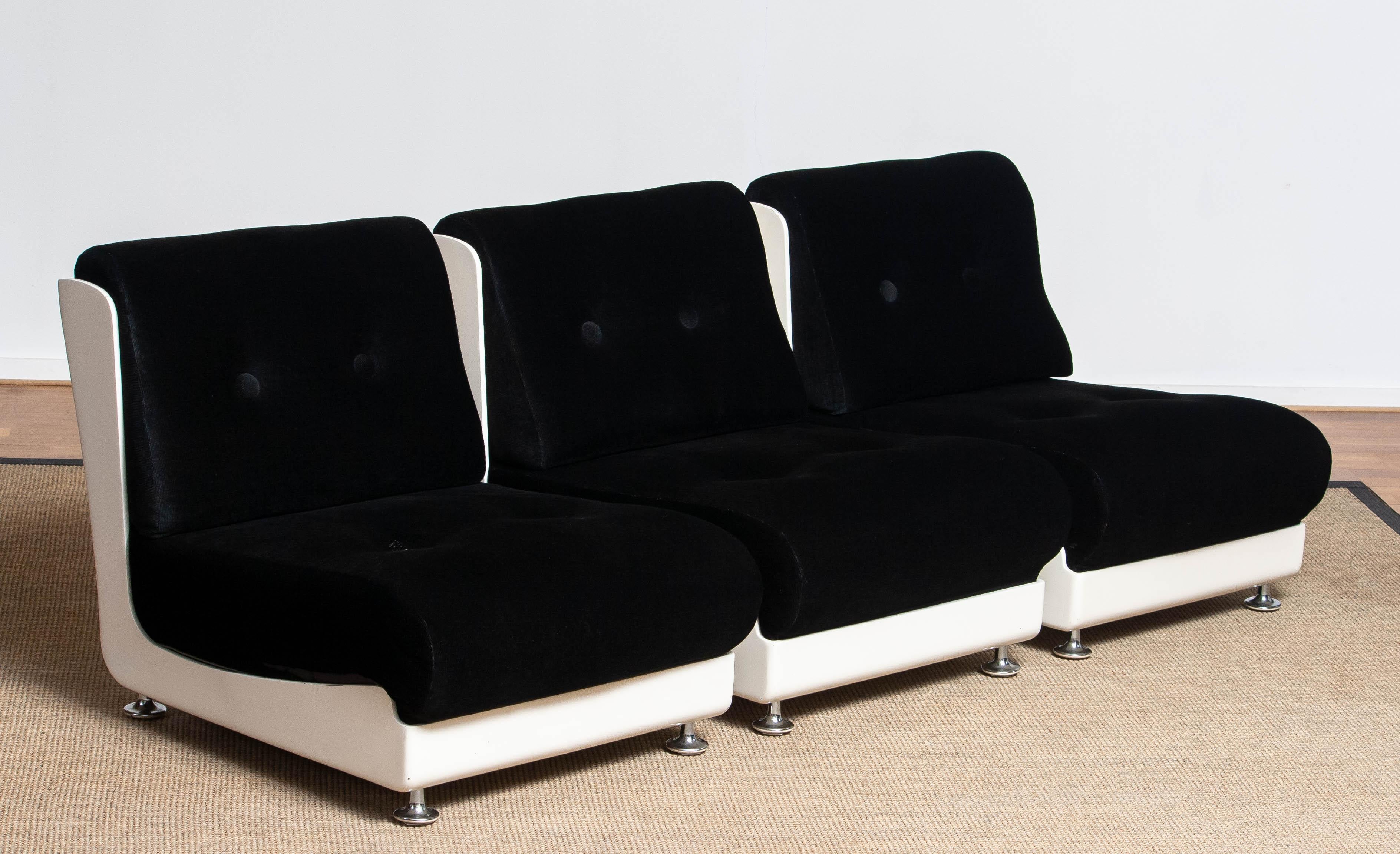 Beautiful set of three original moderen white fiberglass in combination with black corduroy lounge / easy chairs or one sectional sofa designed by Mario Bellini for Roche Bobois 1970's. All three chairs are in very good condition and sits extremely
