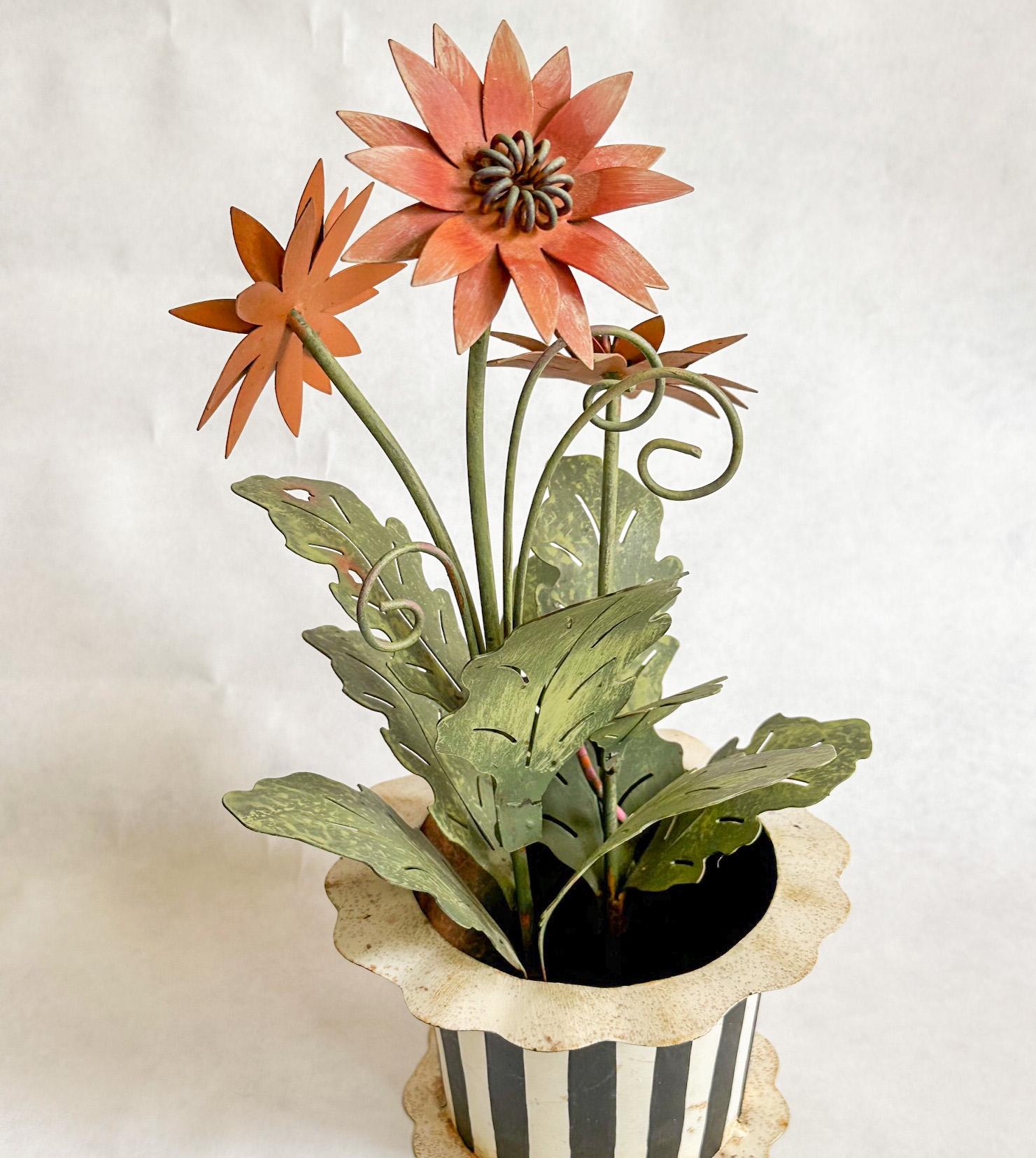 Offered is an elegant tole painted metal expressionist poppy flower plant in a scalloped edge striped container styled after MacKenzie Childs. The details include unfurling leaf tendrils, 