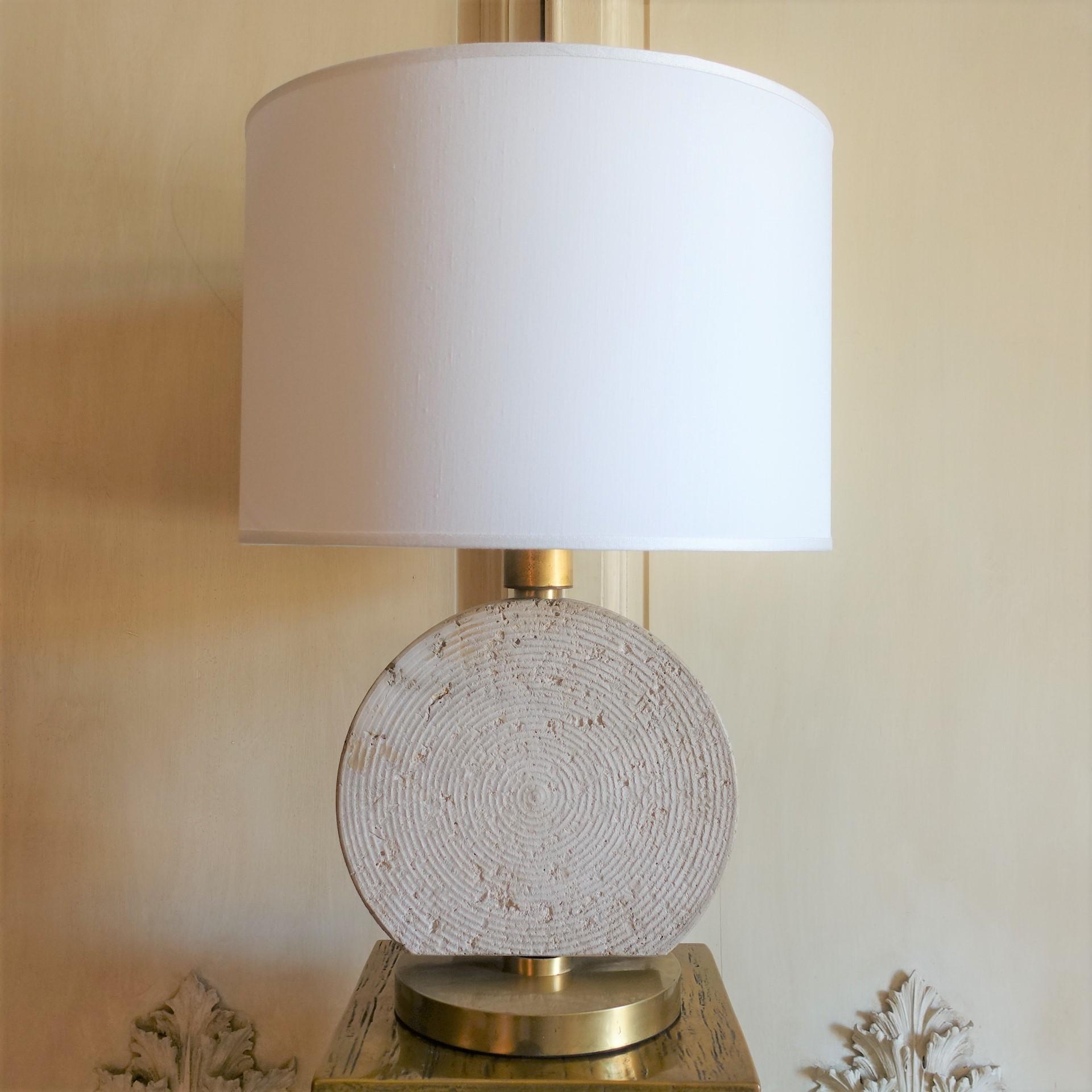 One of a kind table lamp with circular channeled travertine, brass details, vintage patina, base measures cm 30.5x22xh.43, lampshade cm Dia.45xh.30, total height cm 66.