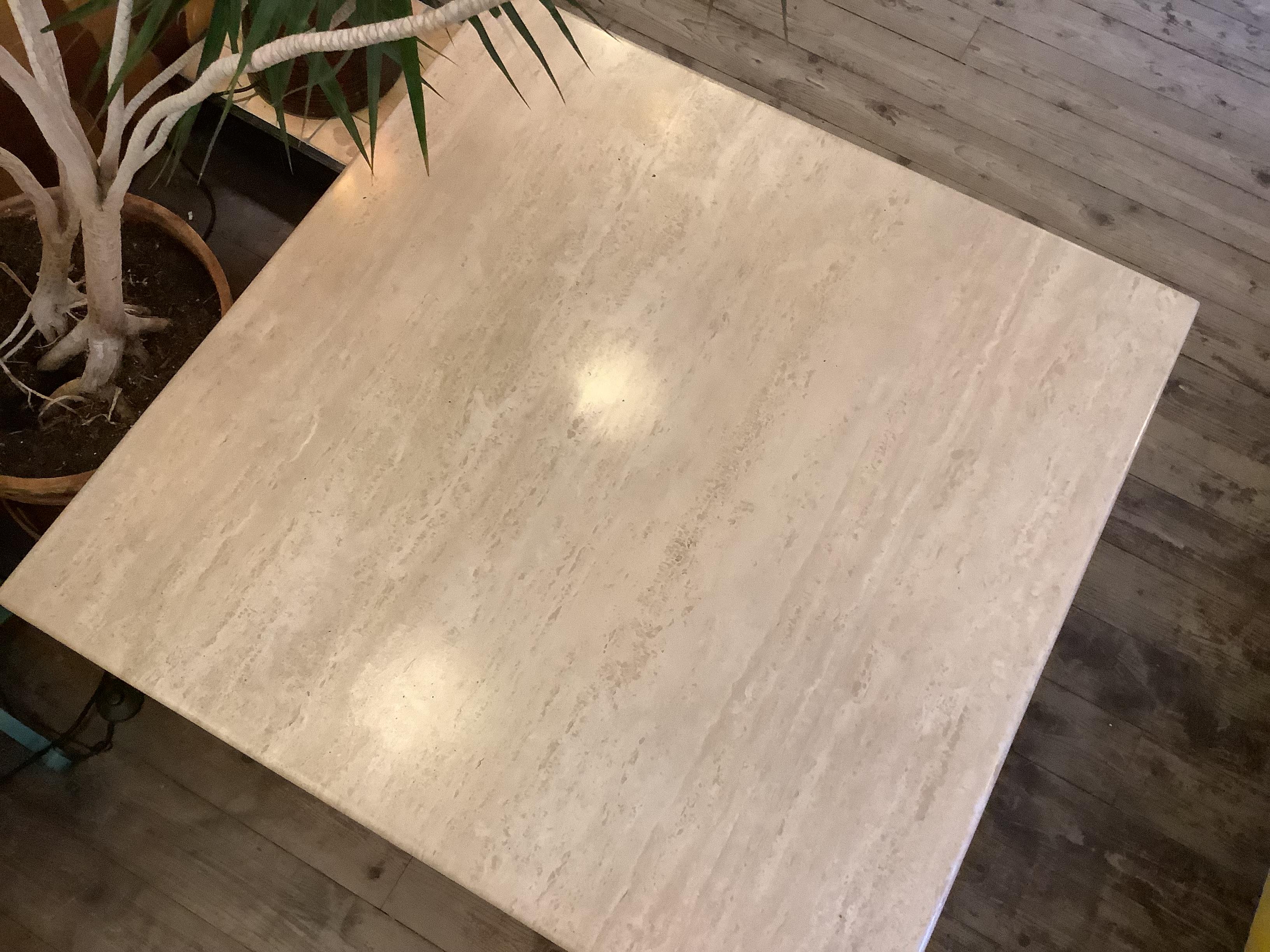 Mid century large Italian Travertine in shape with polished rounded 
edges supported with central base removable for easy transport 
wear on table is consistent with age fantastic statement piece Cc1970's
