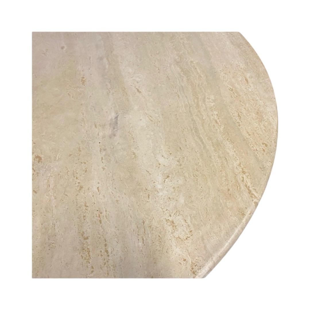 Statement 1970's round dining table in Italian travertine, with tripod column legs. This design classic sits 4-6 guests comfortably and is attributed to Mario Bellini.
Comes with a connecting base plate that ensures the legs are safely locked in