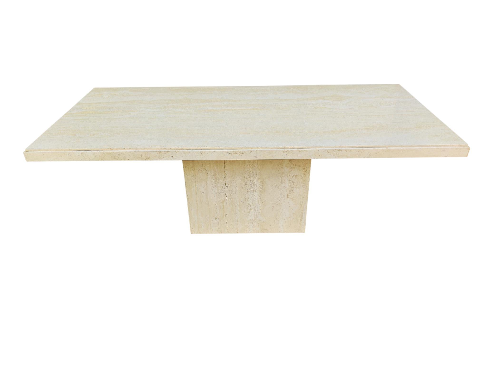 Simple is so often better! This elegant rectangular dining table shows us that. Filled and polished travertine-marble, with just the right amount of attractive natural grain. And a burnished low luster yet highly durable finish. A small channel
