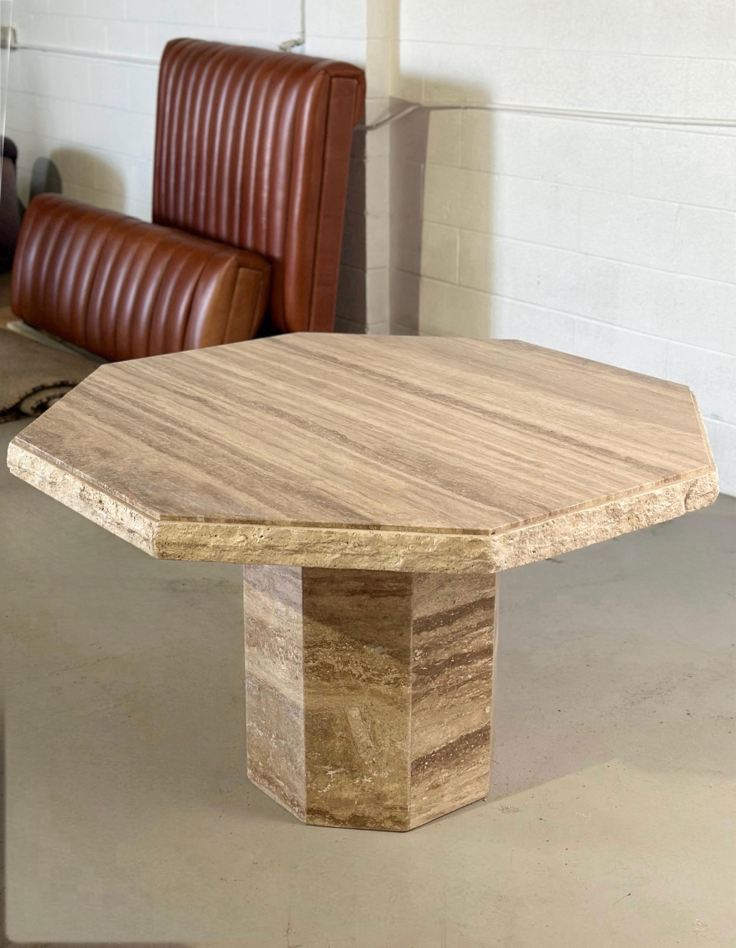 We are very pleased to offer a sophisticated and timeless travertine table, circa the 1970s.  The intricate veining of the travertine adds unparalleled beauty and depth, making it a unique masterpiece.  The table boasts an octagonal top, masterfully