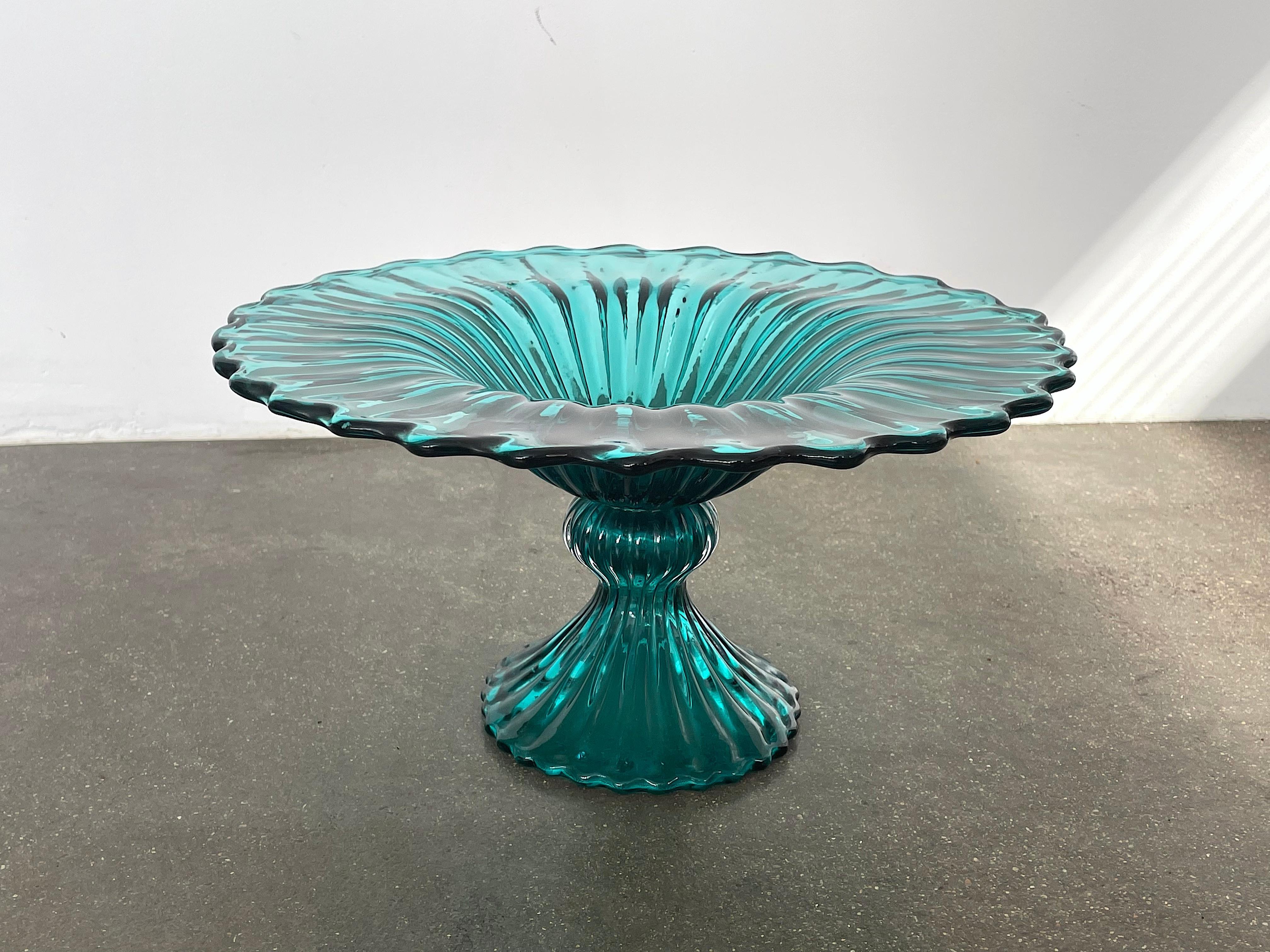 A 20th Century vintage Italian decorative centerpiece or fruit dish made out of handblown blue/green Venetian Murano glass. Designed with a beautiful twisted spiral pedestal base. 
Italy. Circa 1970's

---------
We are an exhibition space and an