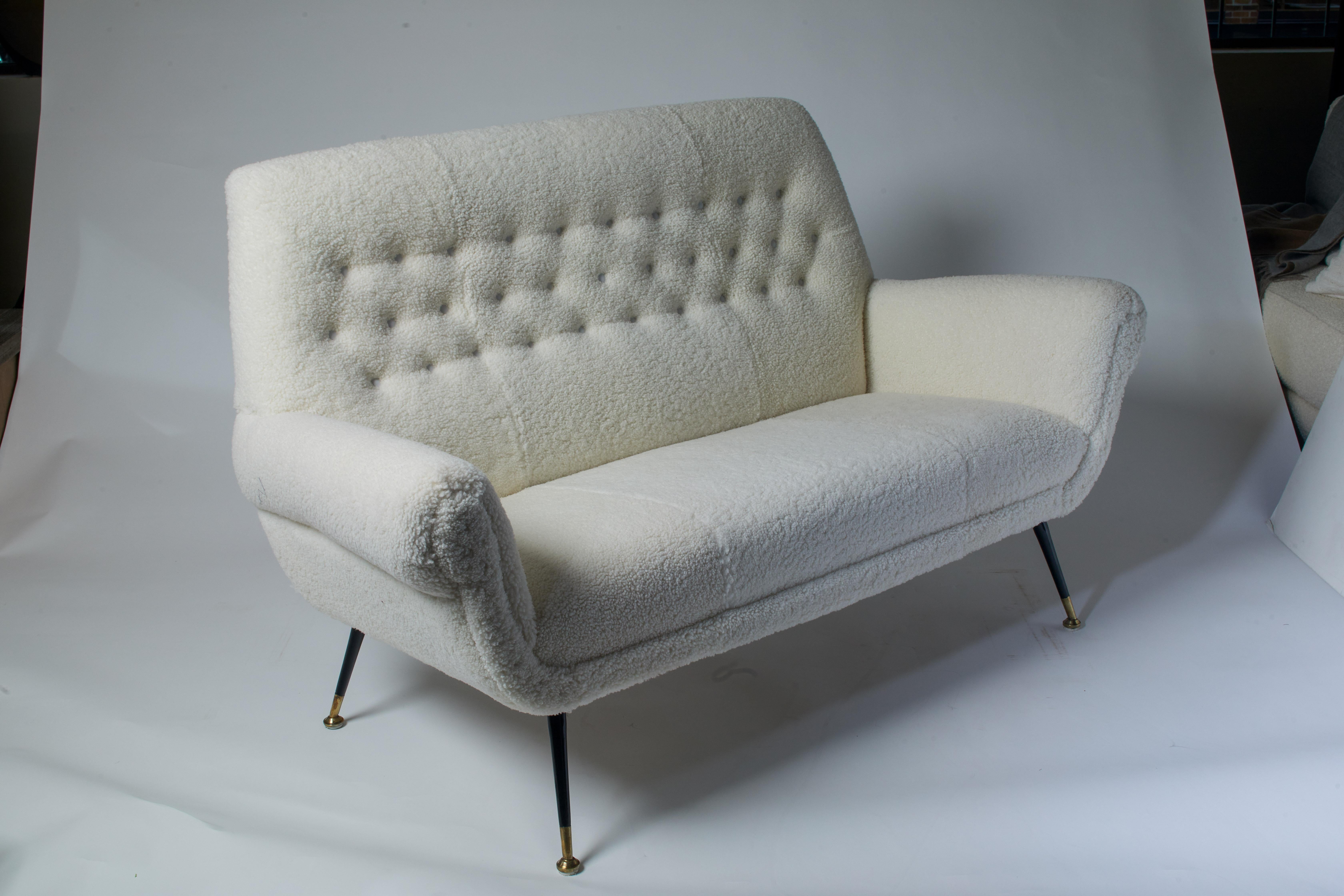 1970s Italian white curly shearling settee with metal legs, fully restored.