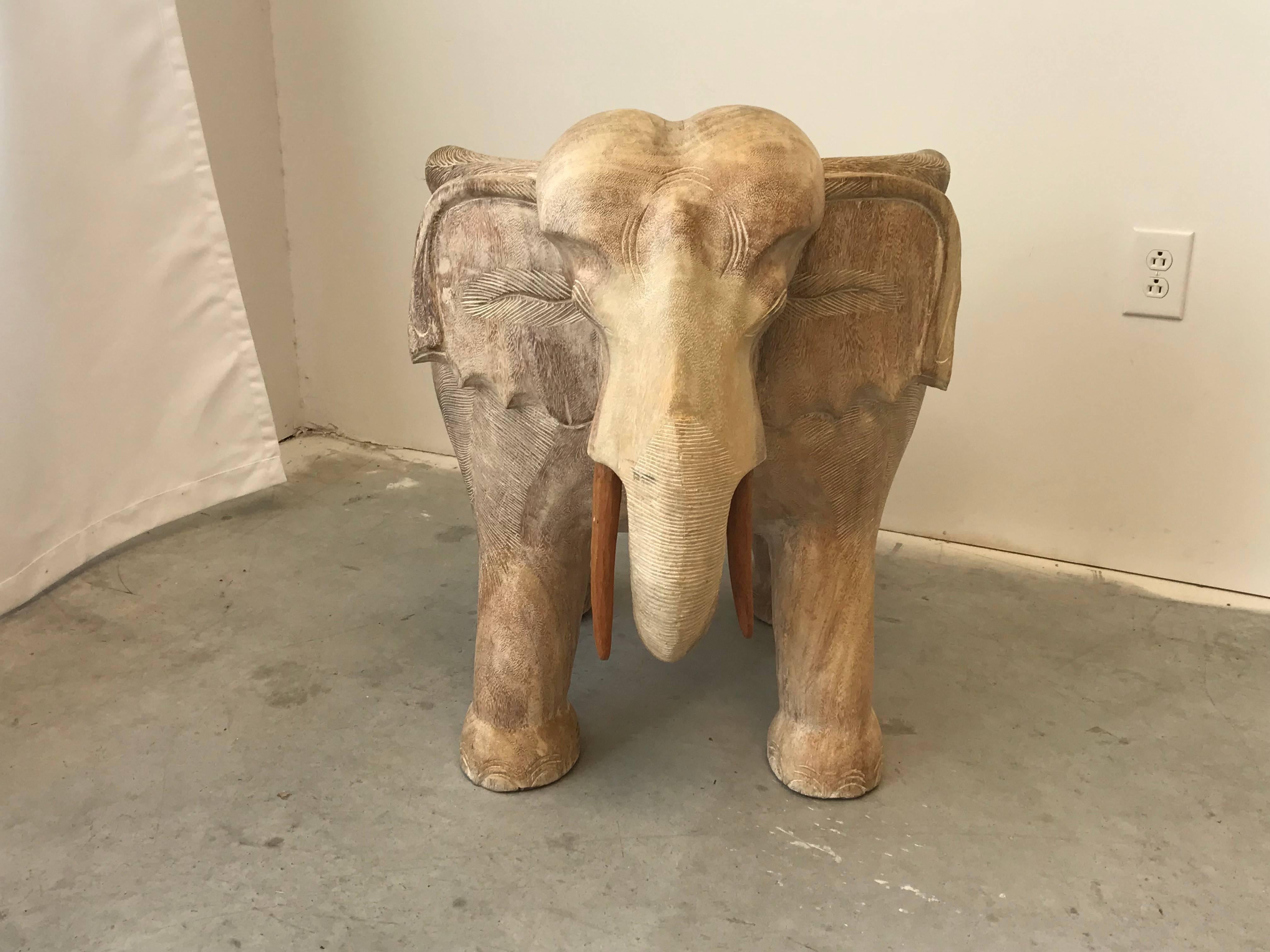 Listed is a fabulous, 1970s Italian solid-wood, sculptural elephant chair. Can easily add a seat cushion. Extremely heavy.