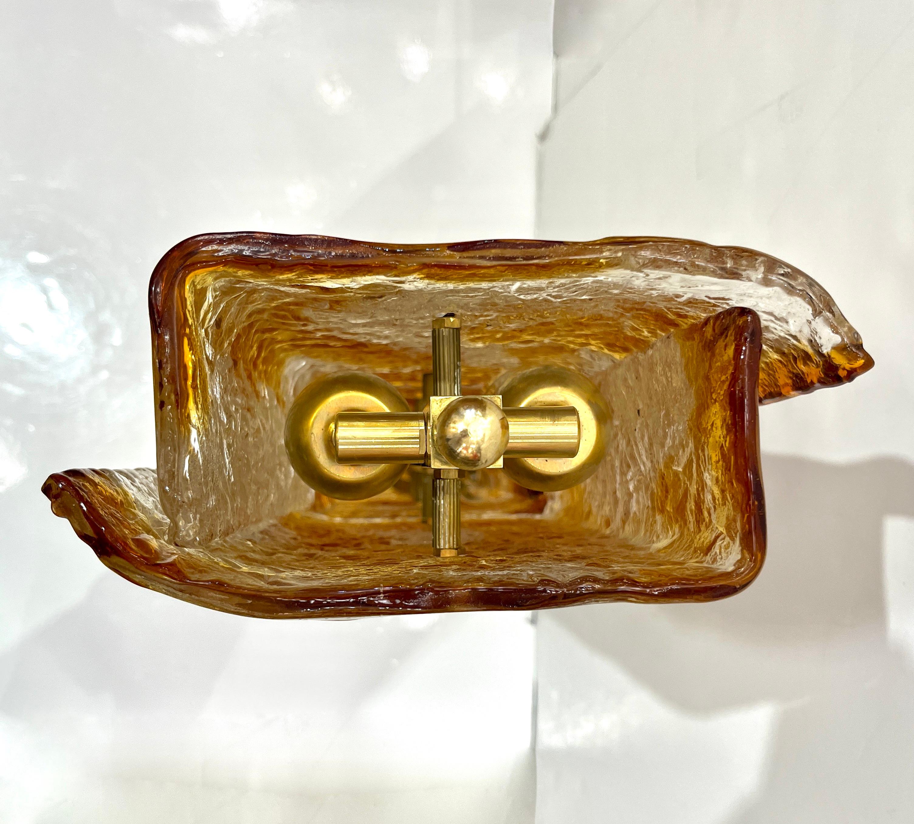 Hand-Crafted 1970s Italy Sculpture Pair Amber Orange Scroll Pattern Murano Glass Table Lamps For Sale