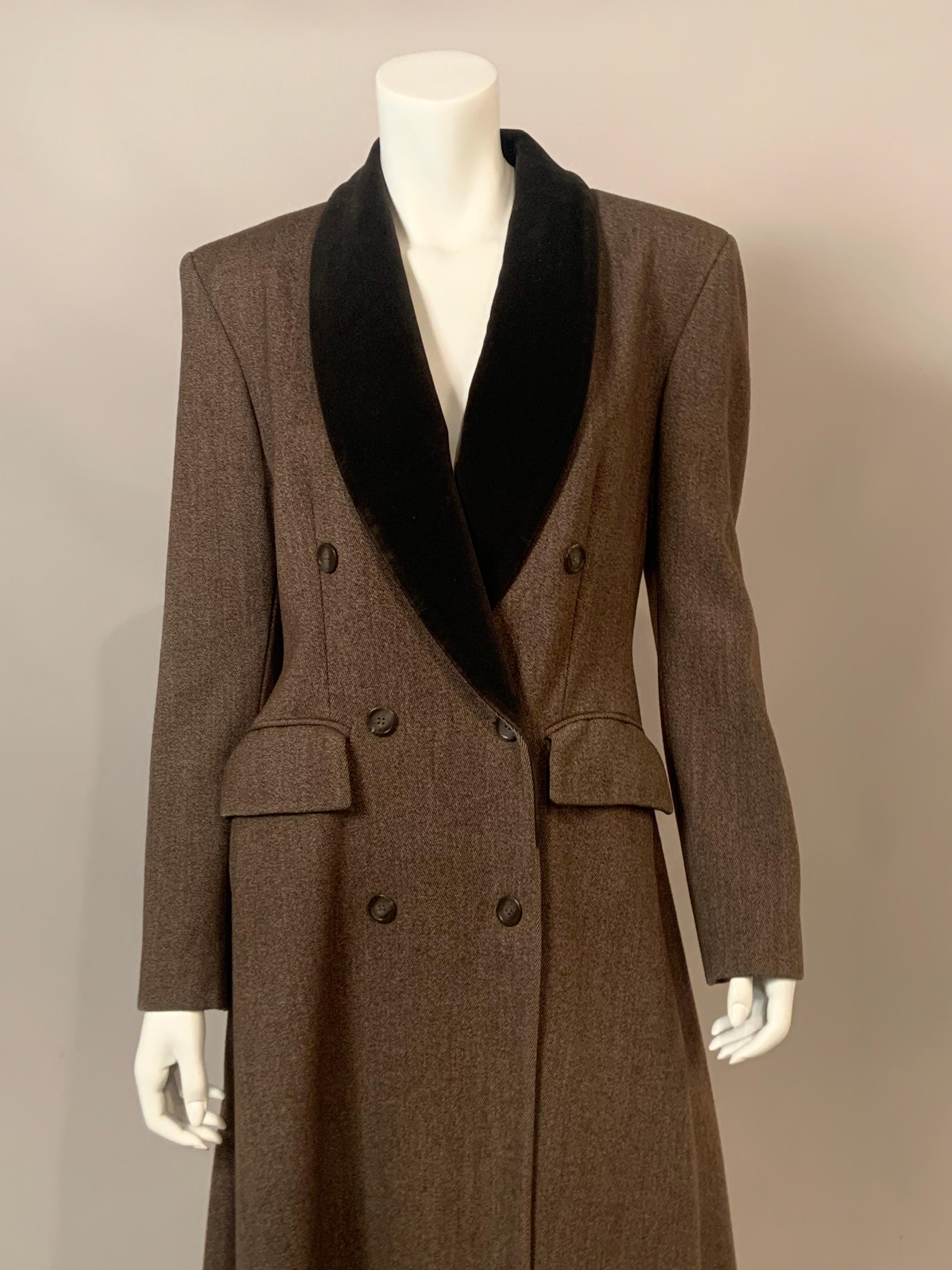 This classic light brown wool coat from Jaeger, London is a maxi coat with a wonderful movement.  The coat has a brown velvet collar, six buttons at the center front and three on the cuffs, two patch pockets and it is fully lined.  It is in