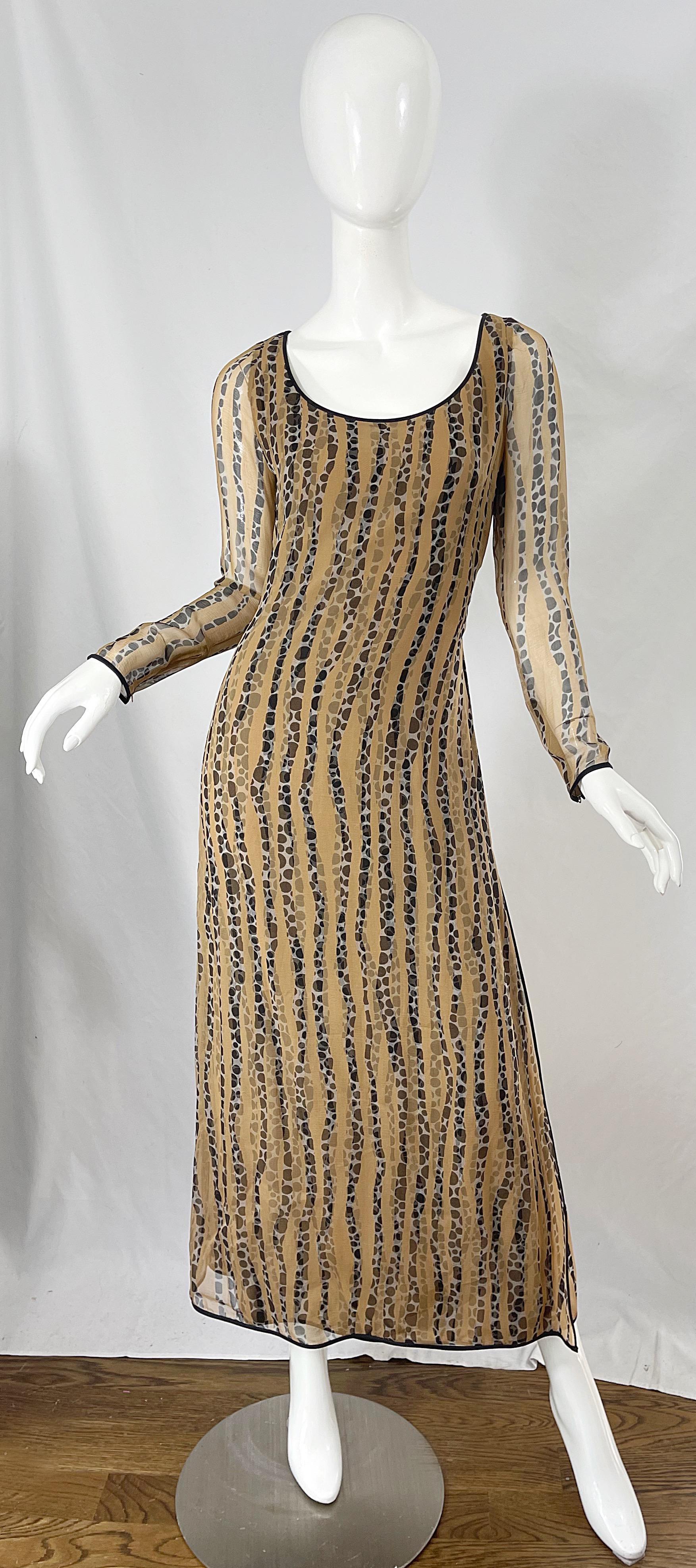 Beautiful 1970s JAMES GALANOS nude, black and white long sleeve chiffon gown ! Features a silk base with polka dot prints, along with a sheer overlay with the same prints, but in contrasting places. Hidden zipper up the back with hook-and-eye