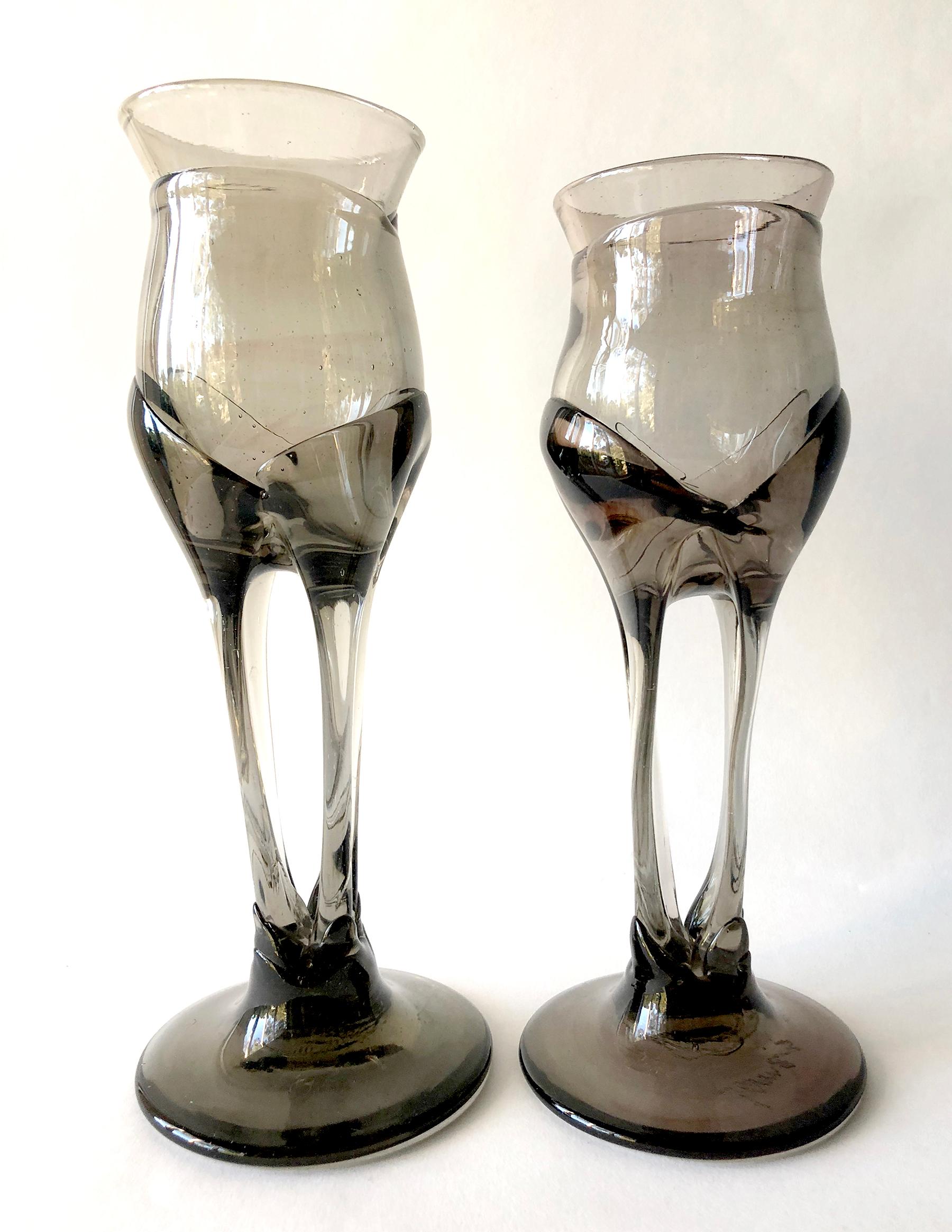 1970s smoked glass organic goblets made by California glass blower, James Wayne. Wayne taught at U.S.C. and San Jose City College and exhibited at the California Design shows in the 1960s and 1970s. Goblets Stand tall 10